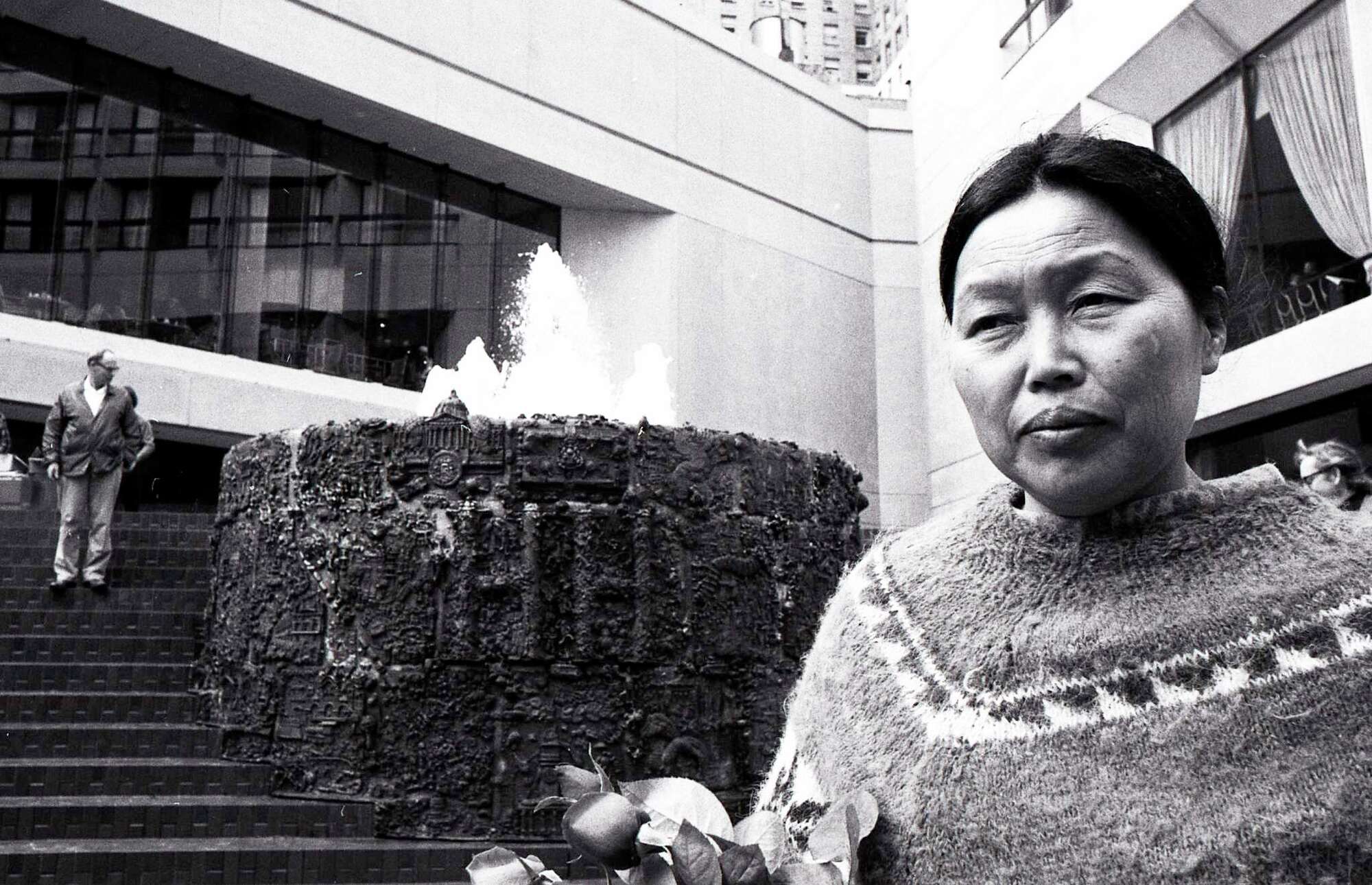 Artist Ruth Asawa is pictured to the right of her "San Francisco Fountain."