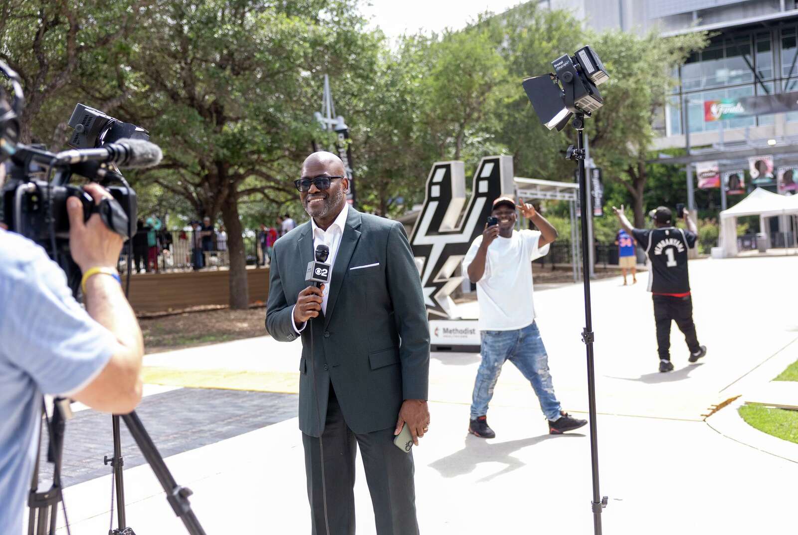 Otis Livingston, sports director for WCBS-TV New York, does a standup outside of Frost Bank Center before Game 1 of the NBA Finals. (Andrew J. Whitaker/San Antonio Express-News)