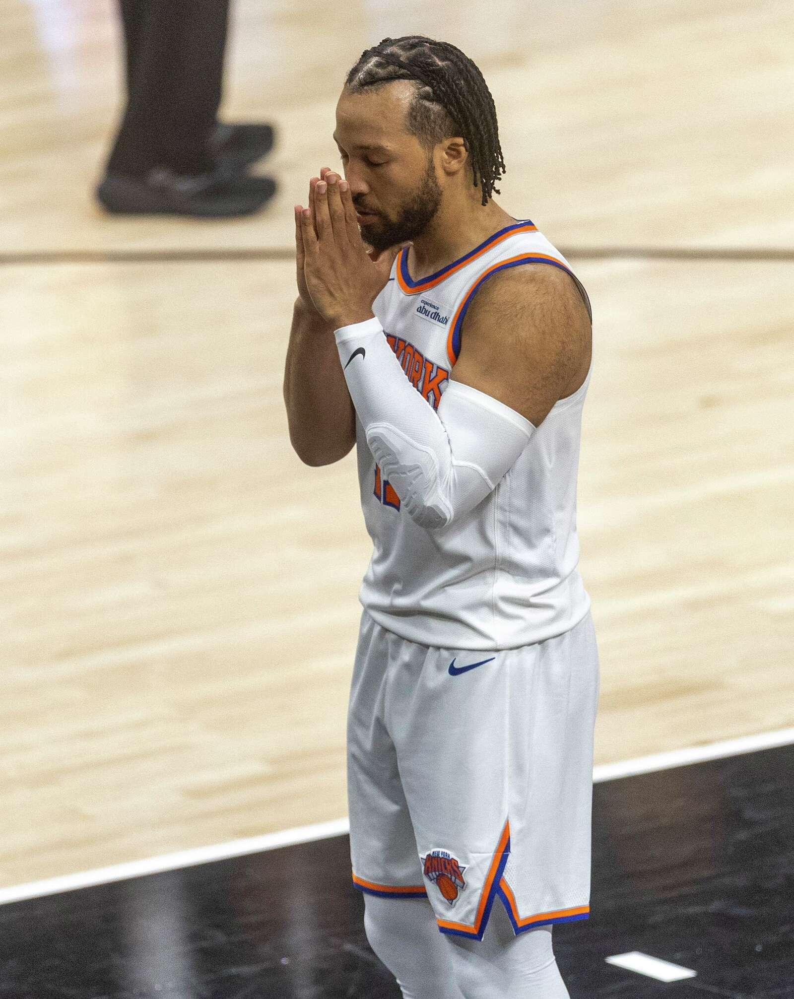 New York Knicks guard Jalen Brunson prays during Game 1 of the NBA Finals at Frost Bank Center in San Antonio. (Andrew J. Whitaker/San Antonio Express-News)