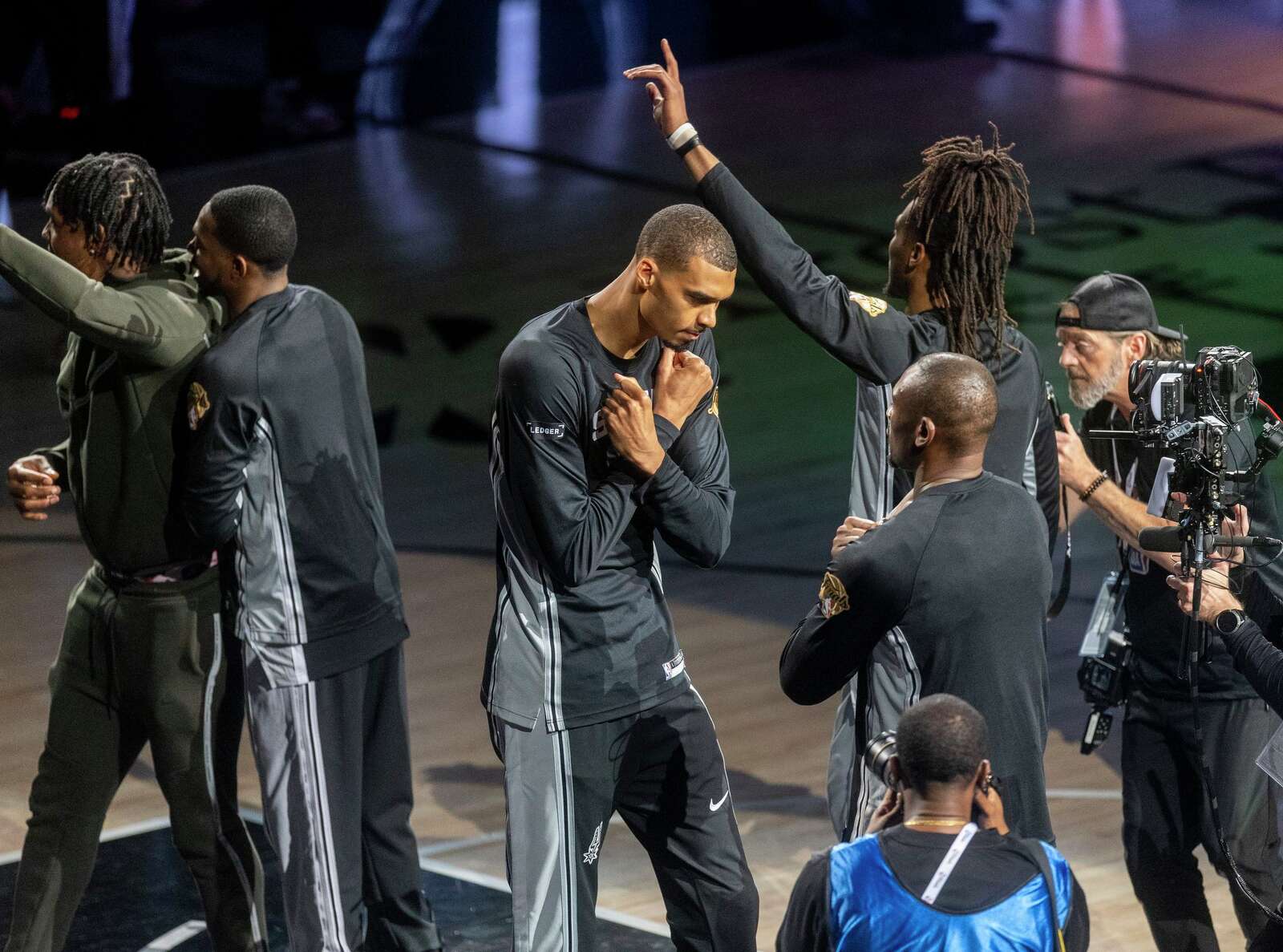 Spurs center Victor Wembanyama walks out onto the court before Game 1 of the NBA Finals against the Knicks. (Andrew J. Whitaker/San Antonio Express-News)