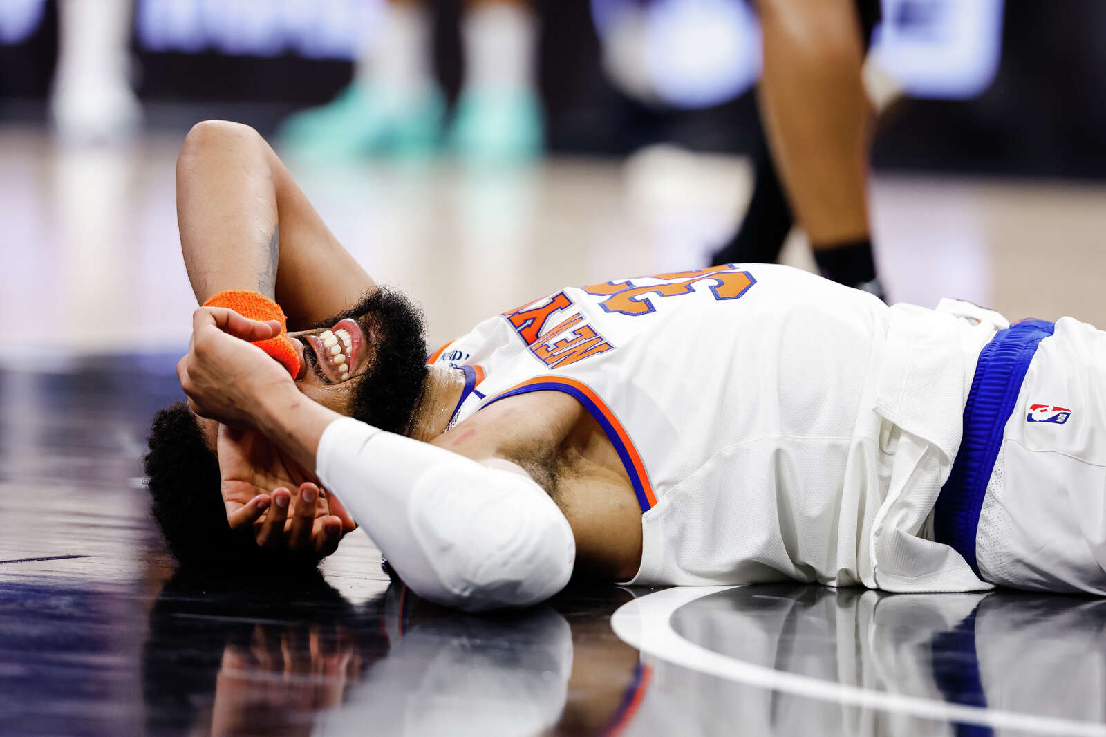 New York Knicks center Karl-Anthony Towns falls to the ground during Game 1 of the NBA Finals against the Spurs. (Sam Owens/San Antonio Express-News)
