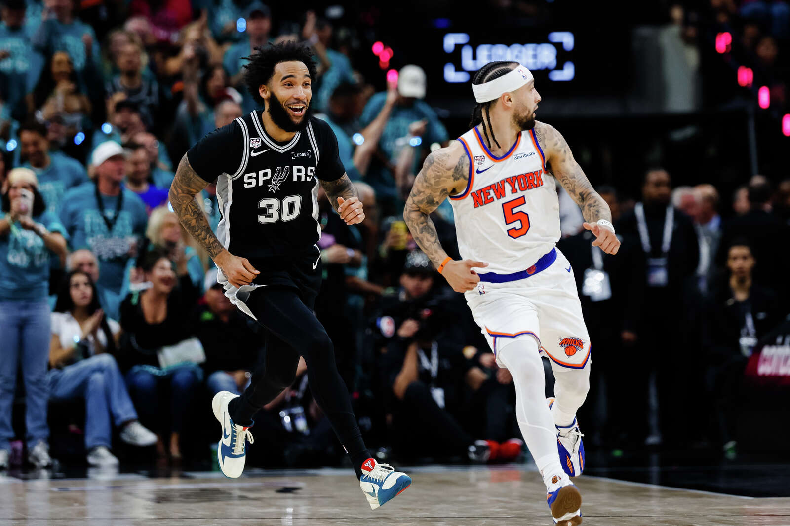 Spurs forward Julian Champagnie celebrates a three-pointer during Game 1 of the NBA Finals against the New York Knicks at Frost Bank Center. (Sam Owens/San Antonio Express-News)