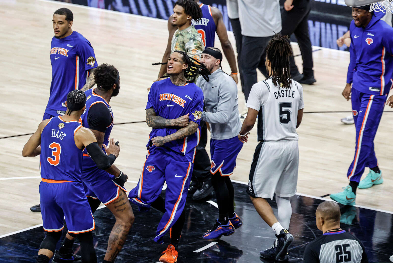 The New York Knicks storm the floor at the end of Friday’s game at Frost Bank Center after beating the San Antonio Spurs 105 to 104 to take a 2-0 lead in the series