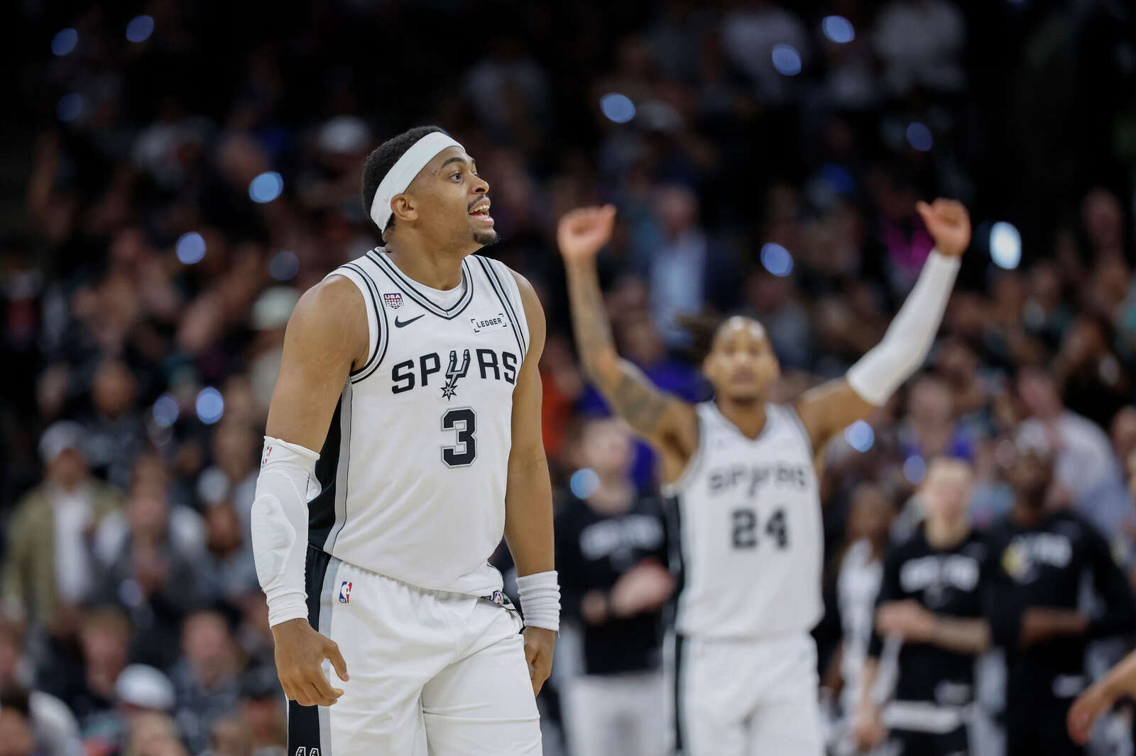 San Antonio Spurs forward Keldon Johnson (3) and San Antonio Spurs guard Devin Vassell (24) react after a big basket during the third quarter.
