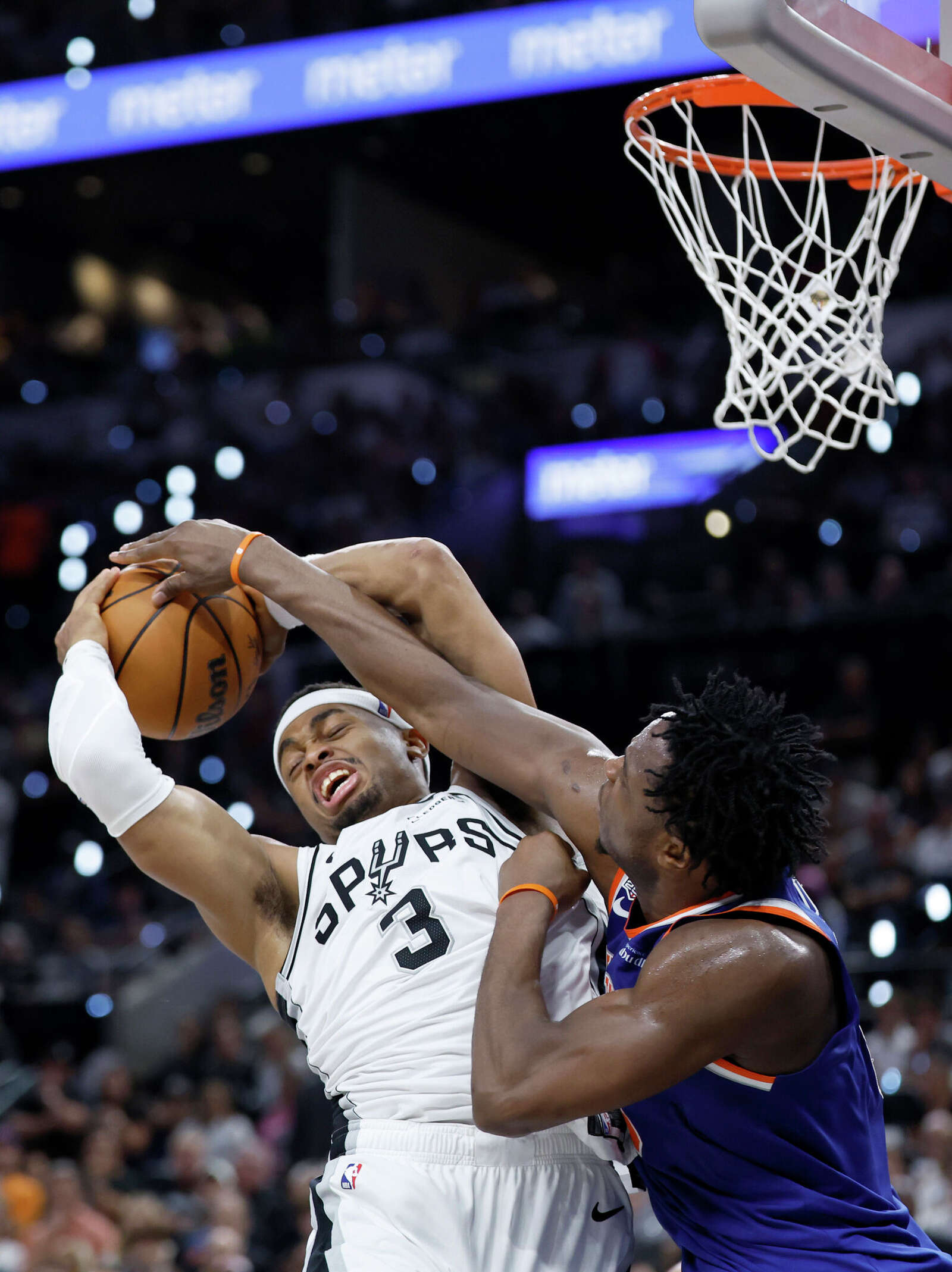 San Antonio Spurs forward Keldon Johnson (3) has a shot blocked by New York Knicks forward Og Anunoby (8) during the third quarter.