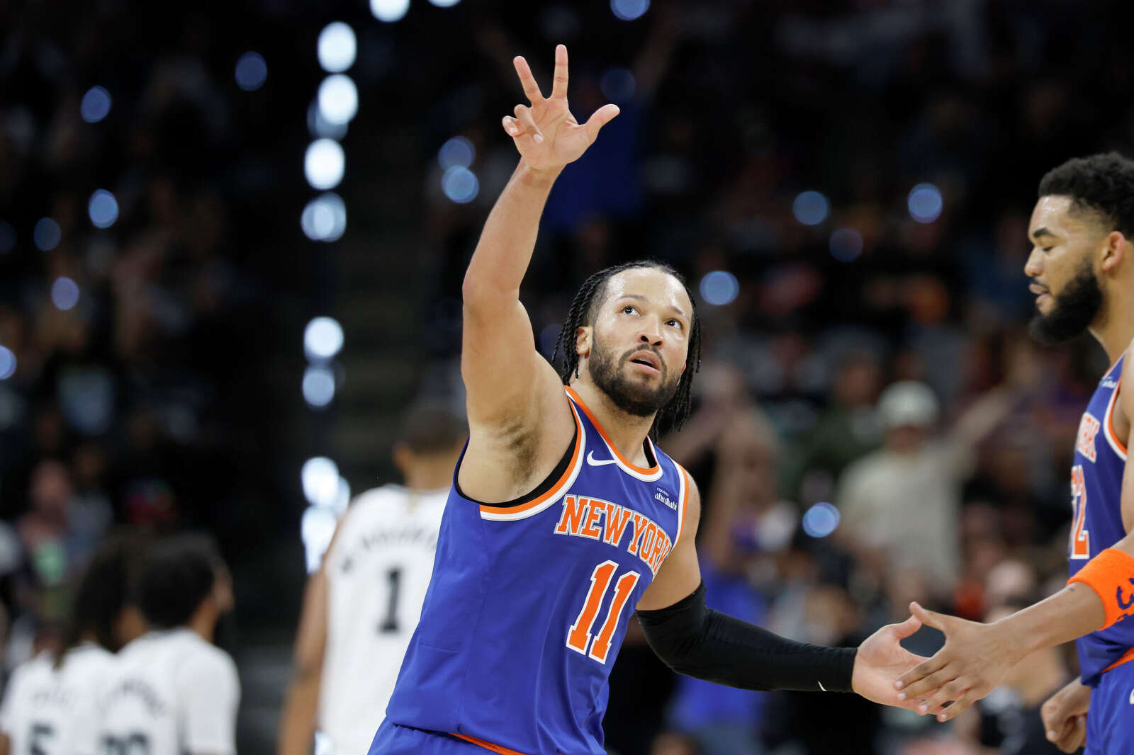New York Knicks guard Jalen Brunson (11) shows some love towards fans after scoring a three point shot during the third quarter.
