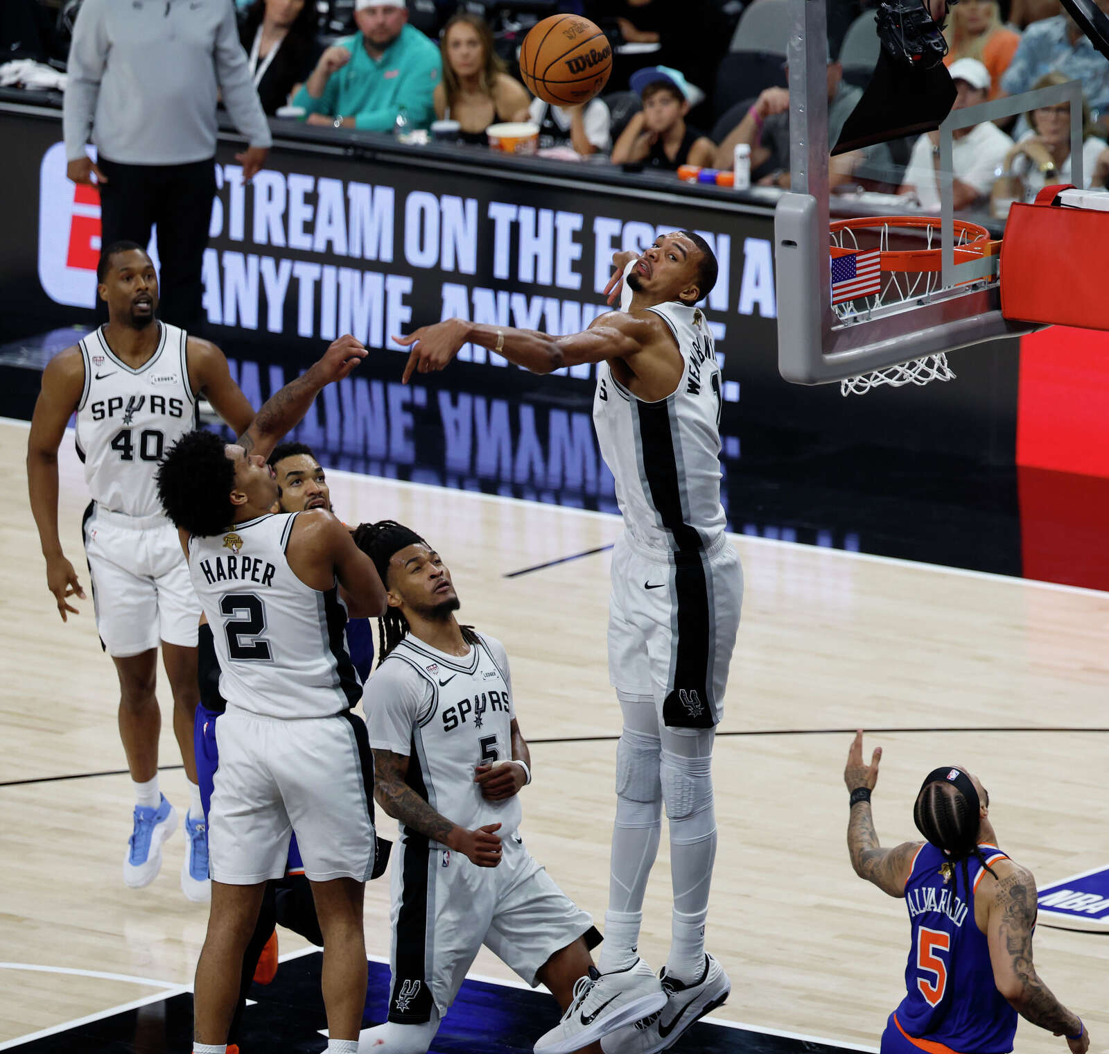 San Antonio Spurs center Victor Wembanyama (1) blocks a shot by New York Knicks guard Jose Alvarado (5) during the second quarter.