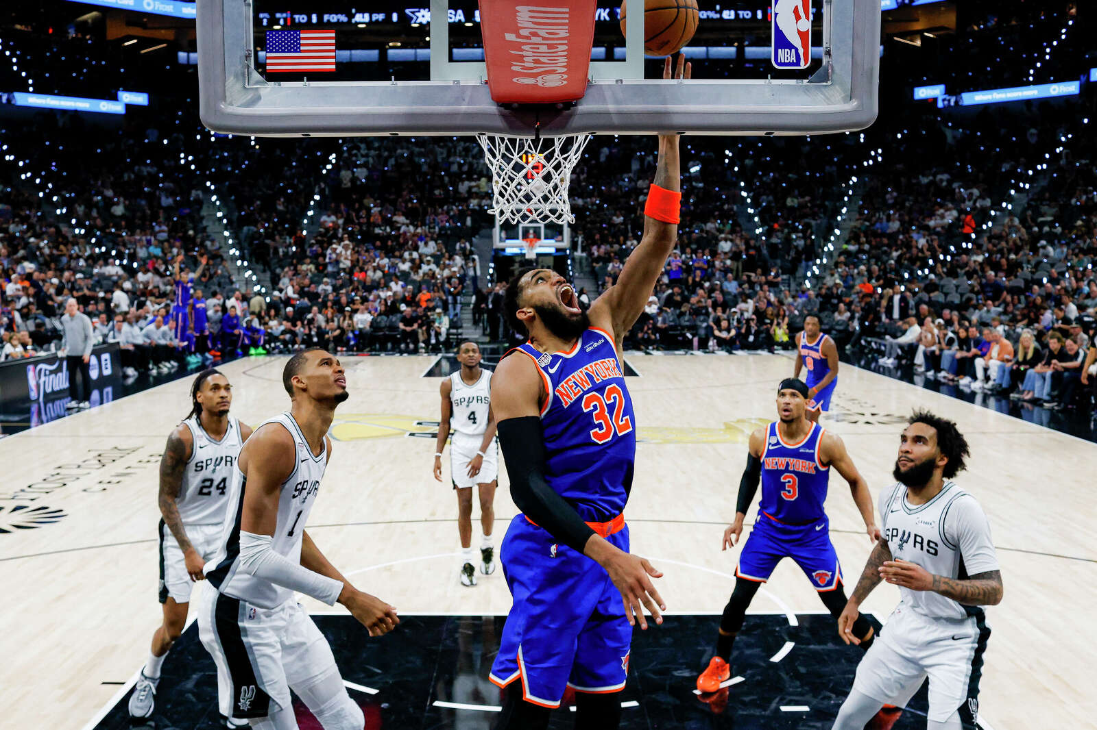 New York Knicks center Karl-Anthony Towns (32) lays the ball in during Game 2 of the NBA Finals against the San Antonio Spurs.