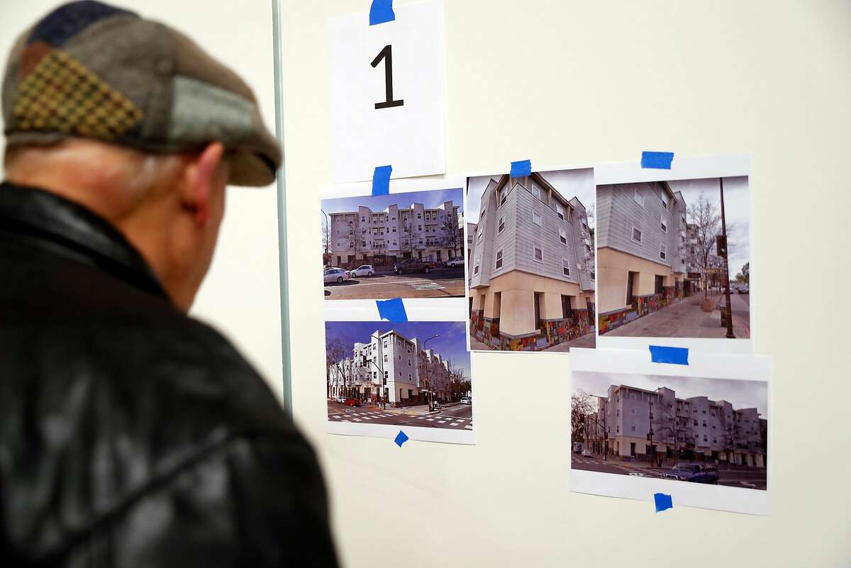 A community member looks at one of the twenty five proposals submitted for housing at North Berkeley BART station before Berkeley City Council meeting in Berkeley, Calif., on Tuesday, January 15, 2019.