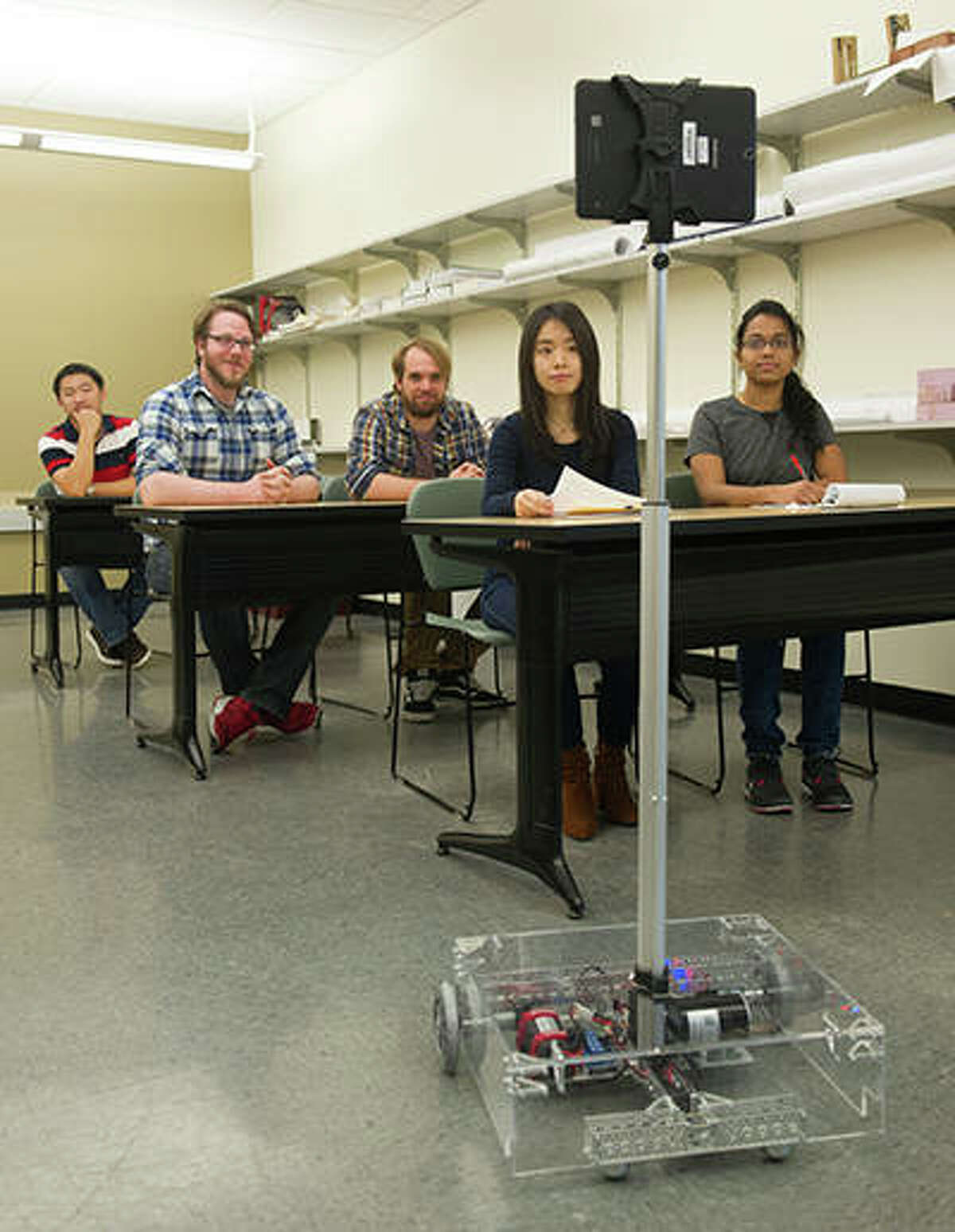 SIUE School of Engineering student researchers test the telepresence robot created for educational settings.