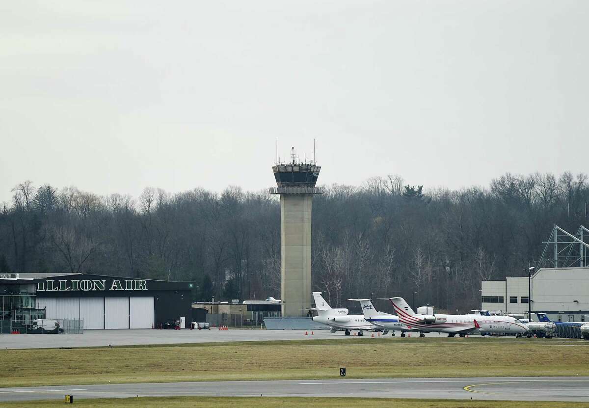 Furloughed government employees work in the air traffic control tower at the Westchester County Airport in White Plains, N.Y. Wednesday, Jan. 16, 2019. Academic journal publisher Mary Ann Liebert, Inc. provided a catered lunch to the air traffic controllers who have been working without pay due to the ongoing government shutdown.