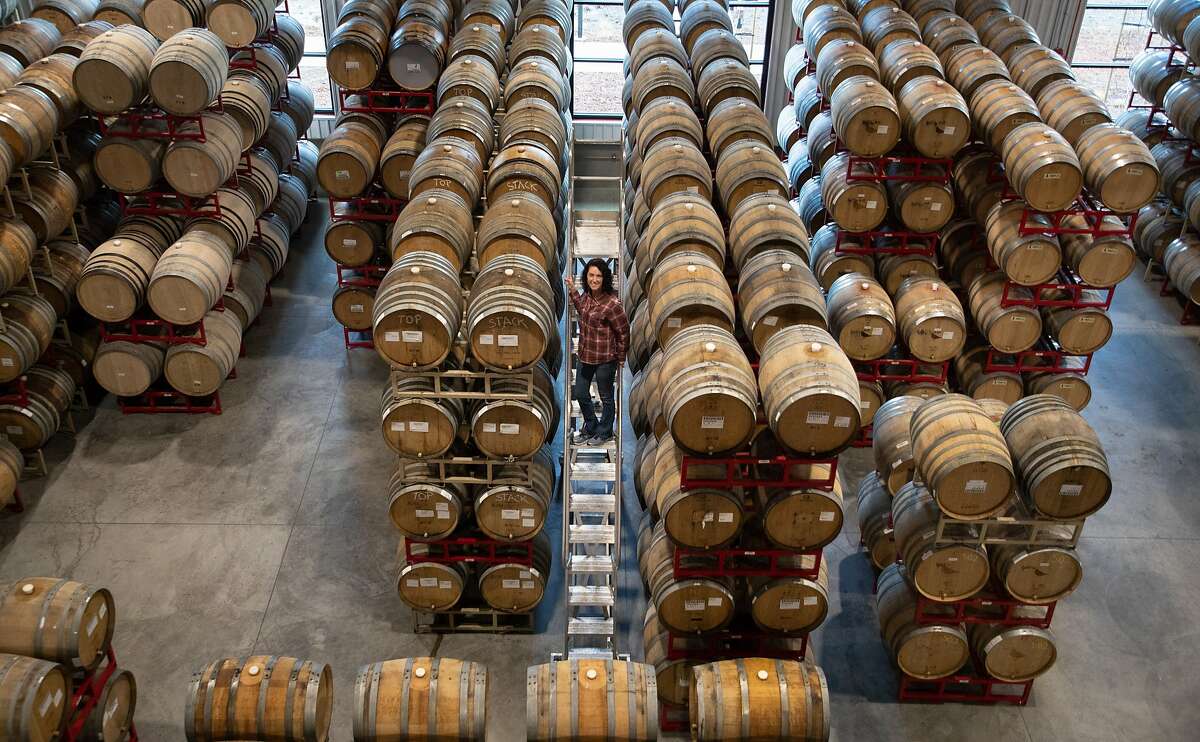 Russian River Brewing Company Co-Owner/President Natalie Cilurzo stands next to barrels of beer on Thursday, Jan. 10, 2019, in Healdsburg, CA.