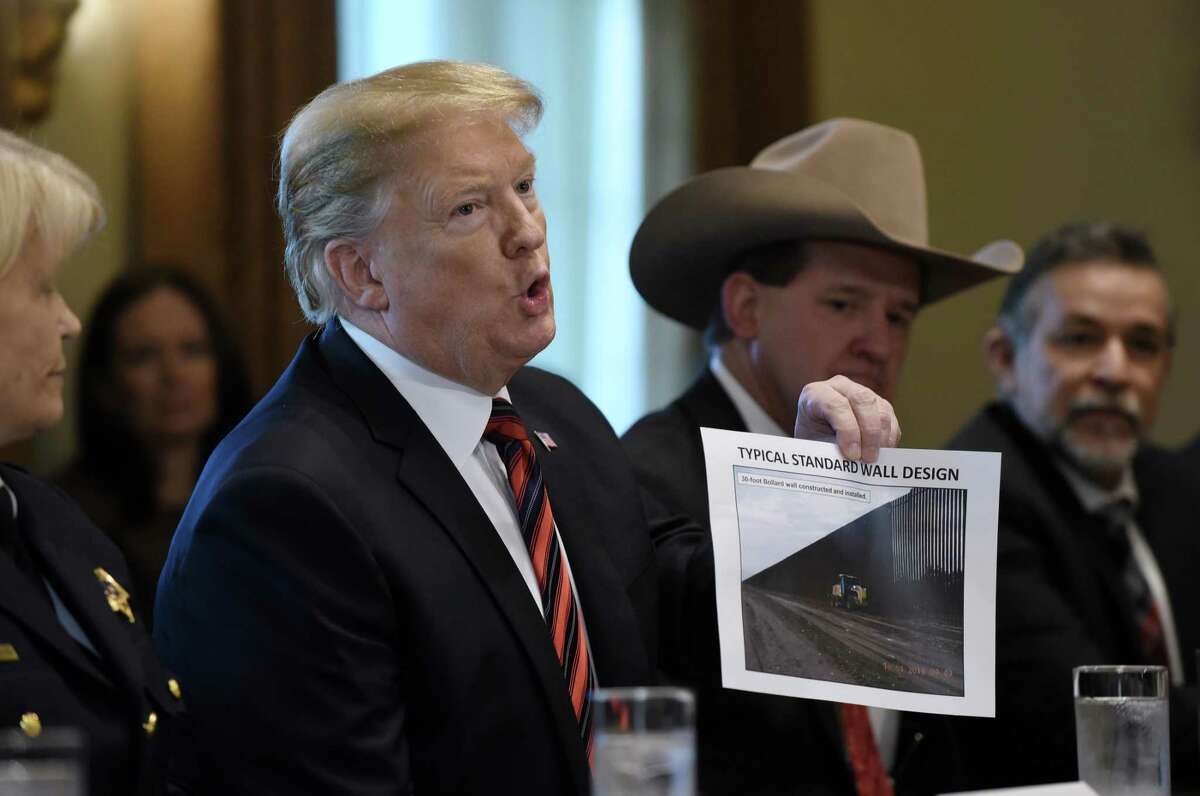 U.S. President Donald Trump shows a border wall design during a roundtable discussion on border security with State, local, and community leaders in the Cabinet Room of the White House on Jan. 11, 2019 in Washington, D.C. (Olivier Douliery/Abaca Press/TNS)