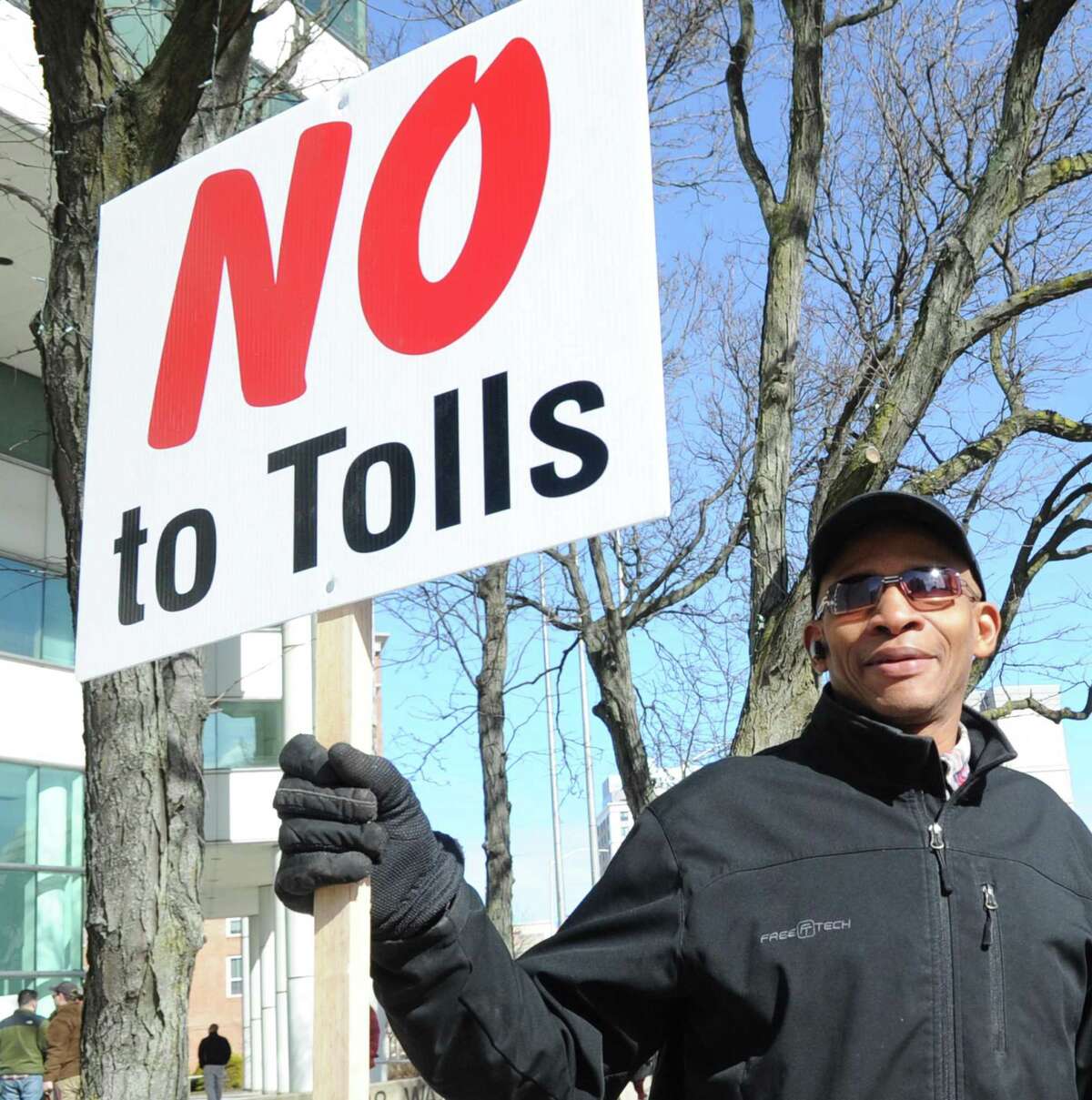 Public protest against tolls, a new gas tax and tire tax, held in front of the Stamford Goverment Center, Stamford, Conn., Saturday, Feb. 17, 2018. Roughly 75 people attended the protest that was accompanied by a caravan of trucks circling the center honking their horns in support of the protest. Gov. Dannel P. Malloy wants legislators to pass measures including electronic tolls, an increase in state gasoline taxes and a new tax on the sale of tires, to pay for Connecticut's transportation system that he says is facing a serious fuding crisis.