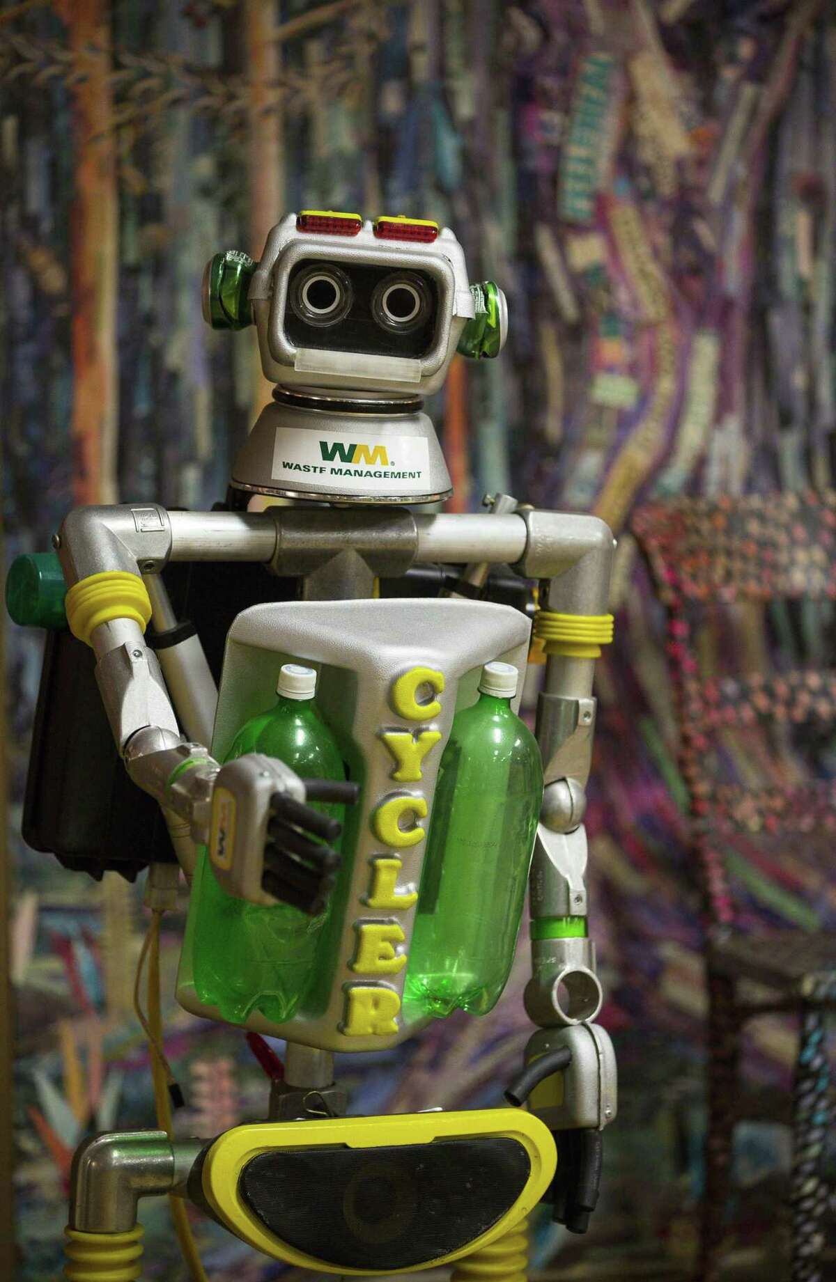 This photo taken Nov. 19, 2018, shows a motorized robot made from recycled materials stands in an education room filled with art made from recycled materials at Waste Management's facility on Gasmer Drive in southwest Houston. ( Mark Mulligan /Houston Chronicle via AP)