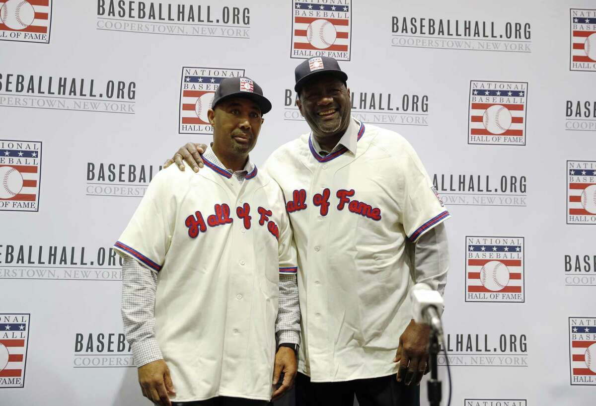 Lee Smith, right, and Harold Baines pose for photographers during a news conference for the National Baseball Hall of Fame during the Major League Baseball winter meetings, Monday, Dec. 10 in Las Vegas.