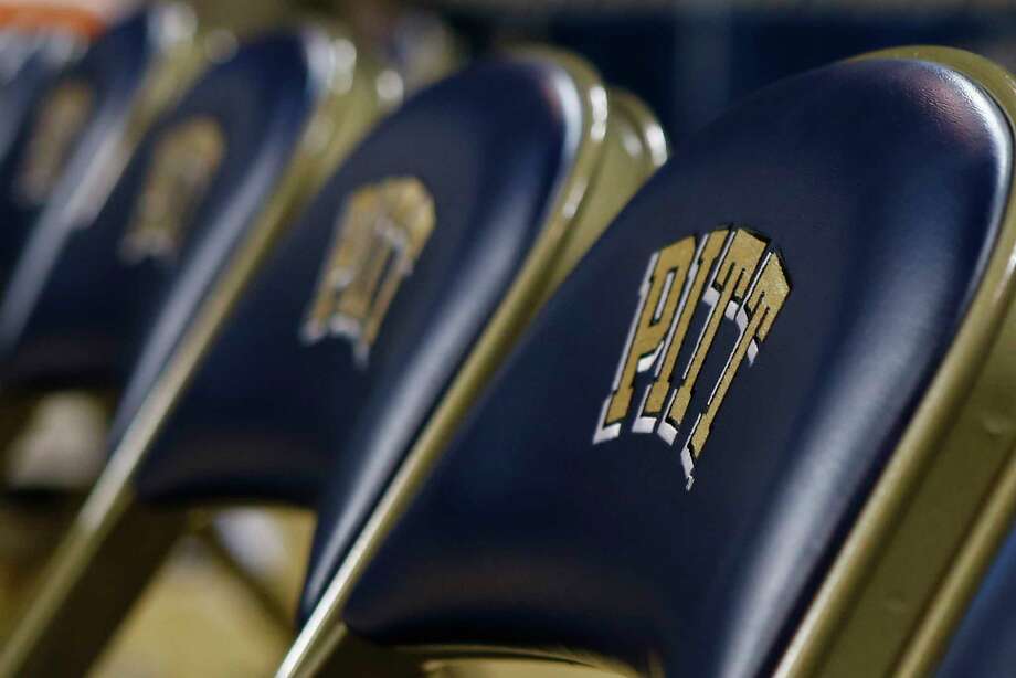 FILE- This Jan. 8, 2015, file photo shows a row of chairs with the "Pitt" logo, for the University of Pittsburgh before an NCAA college basketball game in Pittsburgh. The University of Pittsburgh is offering graduating seniors up to $5,000 in federal student loan relief with one request: They pay it forward. The school?s new program, Panthers Forward, will help recent graduates chip away at student debt and introduce them to alumni mentors to encourage professional development. Students have no obligation to repay the gift, but the university is encouraging recipients to make financial contributions to sustain the program. (AP Photo/Keith Srakocic, File) Photo: Keith Srakocic / Copyright 2019 The Associated Press. All rights reserved.