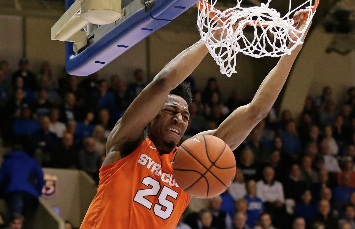 Syracuse's Tyus Battle (25) dunks against Duke during the first half of an NCAA college basketball game in Durham, N.C., Monday, Jan. 14, 2019. (AP Photo/Gerry Broome)