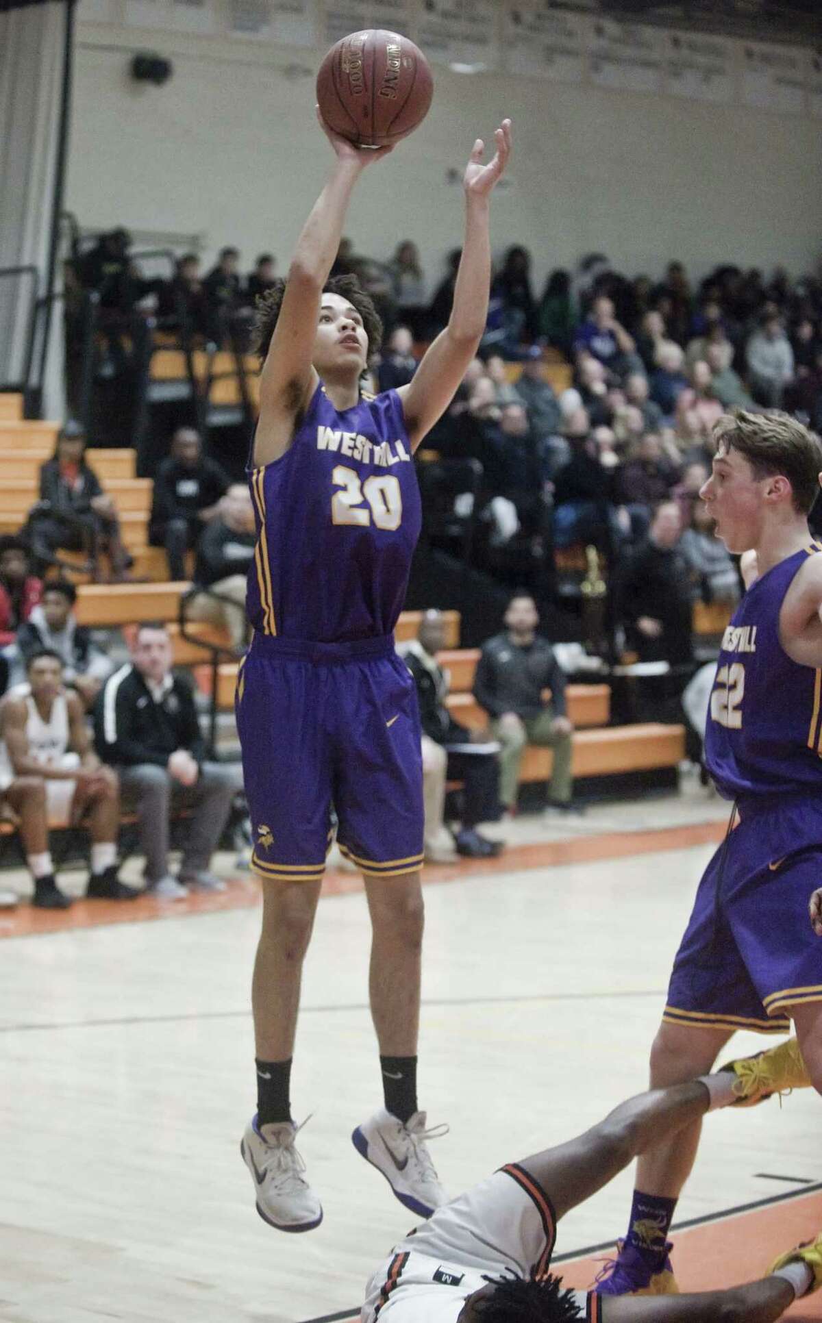 Westhill High School's Brian Martin releases a shot off in a game against Stamford High School, played at Stamford High School. Saturday, Jan. 19, 2019