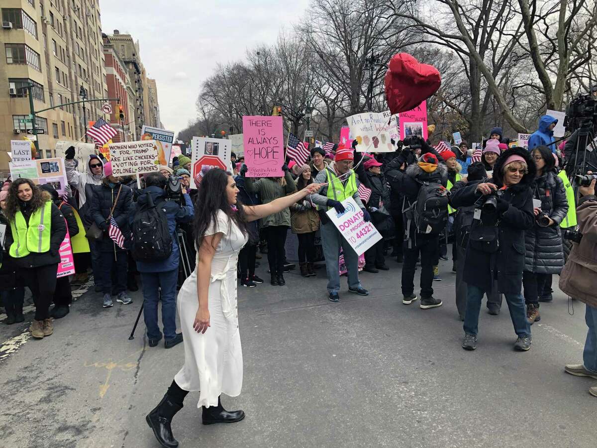 Connecticut artist recreates well-known Banksy painting at Women's March in New York City on Jan. 19, 2019.
