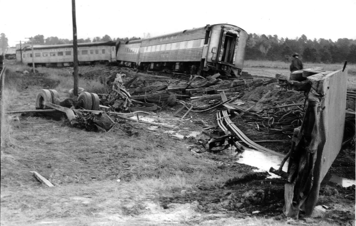 From the Jan. 17, 1959, Houston Chronicle: A heavily laden truck carrying steel crashed into the locomotive of the Rock Island Railroad's "Rocket" at a North Harris County crossing Friday, killing the truck driver and derailing the passenger train. In the left foreground, to the right of the truck's wheels, is all that is left of the truck cab in which Ray Dawkins (Dawson) of Dallas died. At right foreground is the truck's top. The area is littered with debris. Background, the derailed train coaches.
