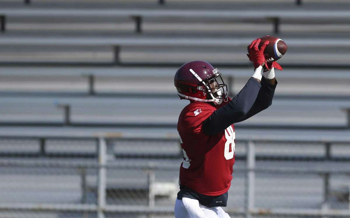 Jevoni Robinson, catching a pass during a San Antonio Commanders’ practice, is making the switch from college and pro basketball to pro football. After playing pro basketball in Italy, he was with the Houston Texans during training camp in 2018.