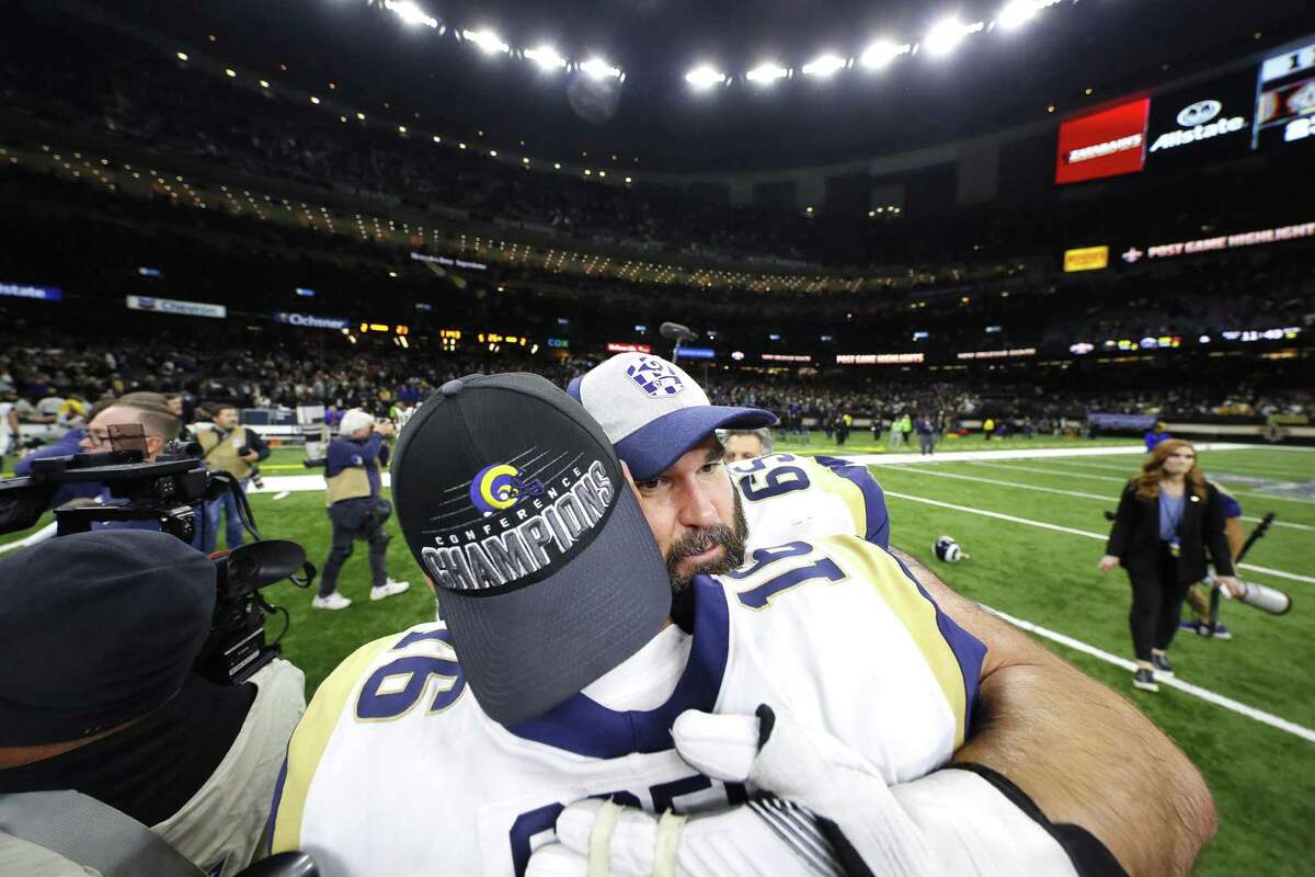 John Sullivan (65) and Jared Goff (16) of the Los Angeles Rams celebrate after defeating the New Orleans Saints in the NFC Championship game at the Mercedes-Benz Superdome Sunday.