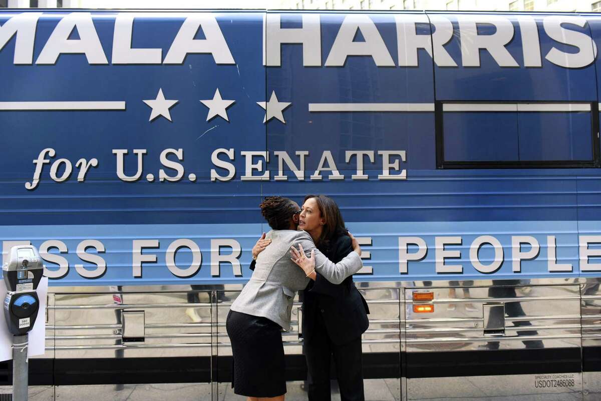 Then-California Attorney General Kamala Harris (right), during her candidacy for U.S. Senate, hugs BART board candidate Lateefah Simon in November 2016.