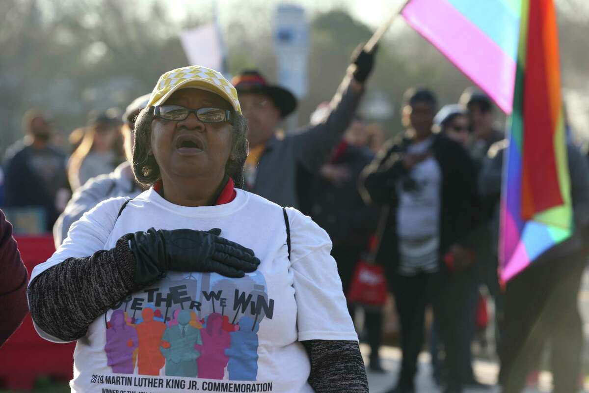 Paulette Burns, 67, joins in a service at ML King Academy, before the Martin Luther King, Jr. March, Monday, January, 21, 2019.