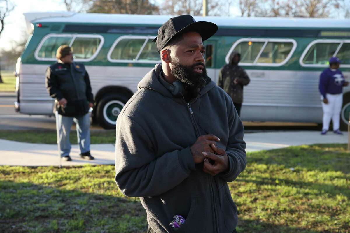 Beau Springs, 35, joins in a service at ML King Academy, before the Martin Luther King, Jr. March, Monday, January, 21, 2019.