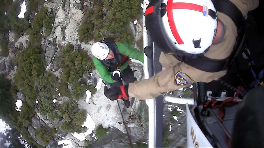 See a helicopter rescue two hikers who were wedged in a crevasse in Yosemite