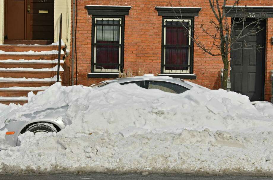Nearly 200 Cars Towed In Albany County During Snow Emergencies A Car Is Mostly Buried Under Snow The Day After Snowstorm On Monday Jan