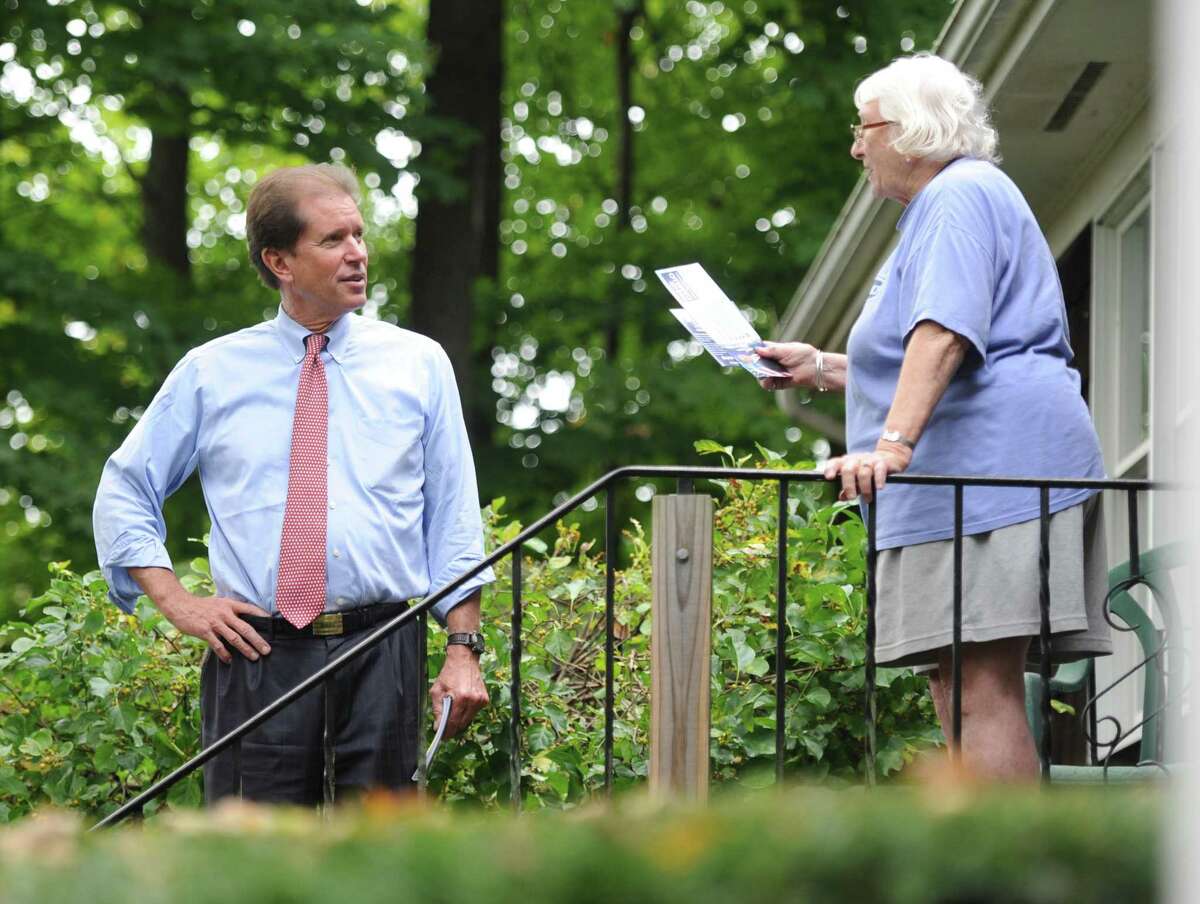 Veteran state Sen. L. Scott Frantz, R-Greenwich, shown here meeting a voter last fall, was upset by Democratic challenger, now-state Sen. Alex Bergstein, who spent about $321,000, including $285,000 of her own money.
