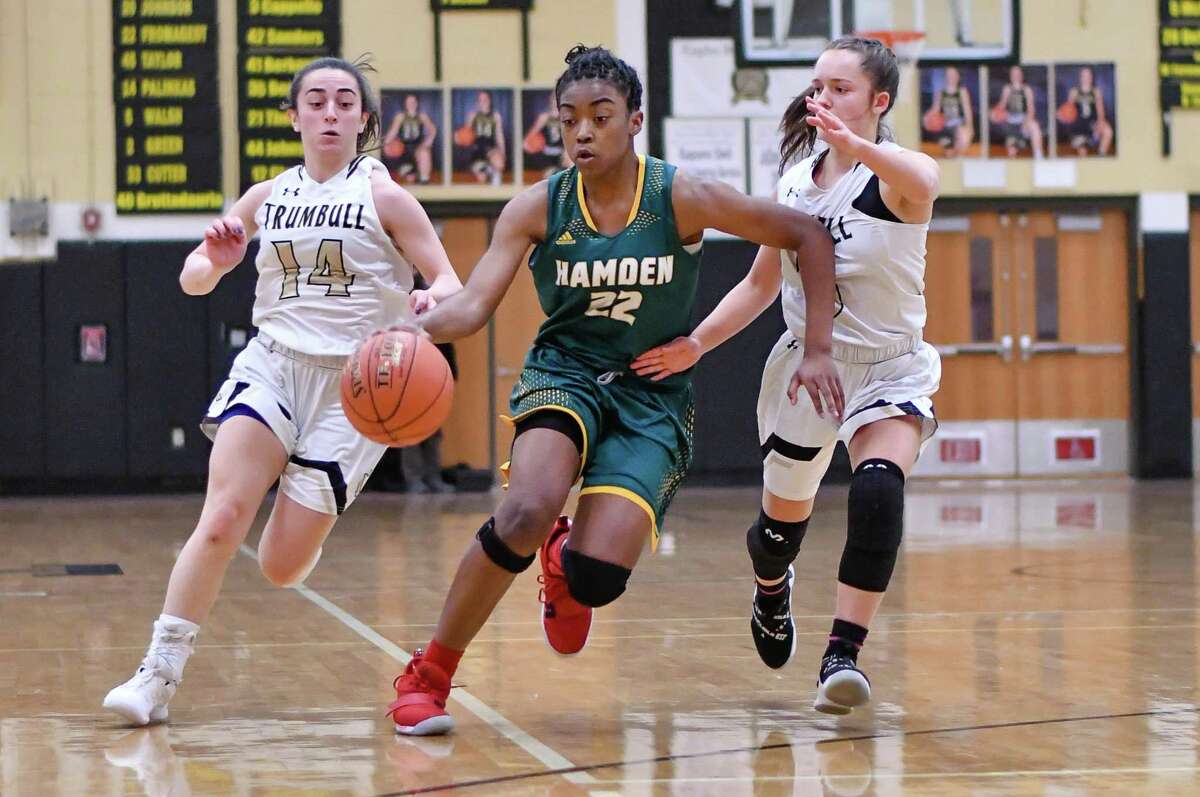 Taniyah Thompson (22) of the Hamden Green Dragons brings the ball up the floor during a game against the Trumbull Eagles on Monday January 21, 2019 at Trumbull High School in Trumbull, Connecticut.