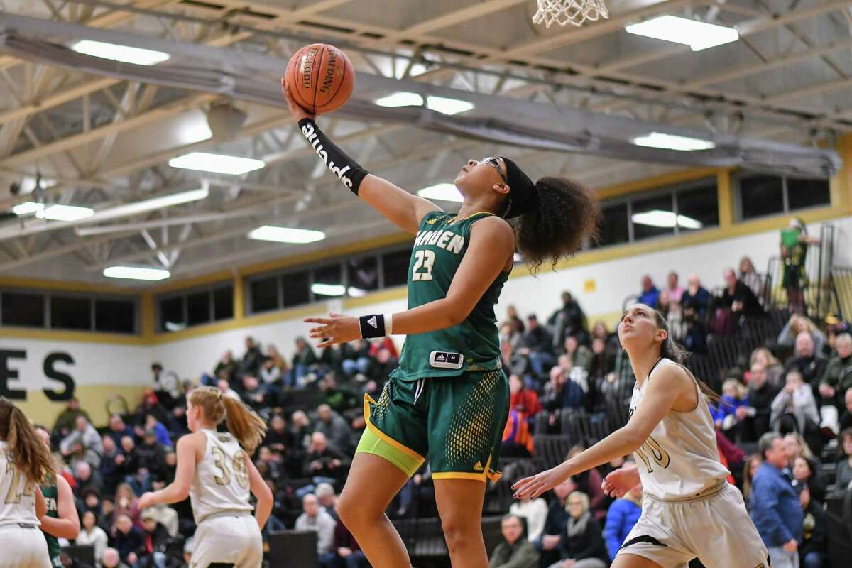 Makaela Johnson (23) of the Hamden Green Dragons scores on a reverse lay up during a game against the Trumbull Eagles on Monday January 21, 2019 at Trumbull High School in Trumbull, Connecticut.