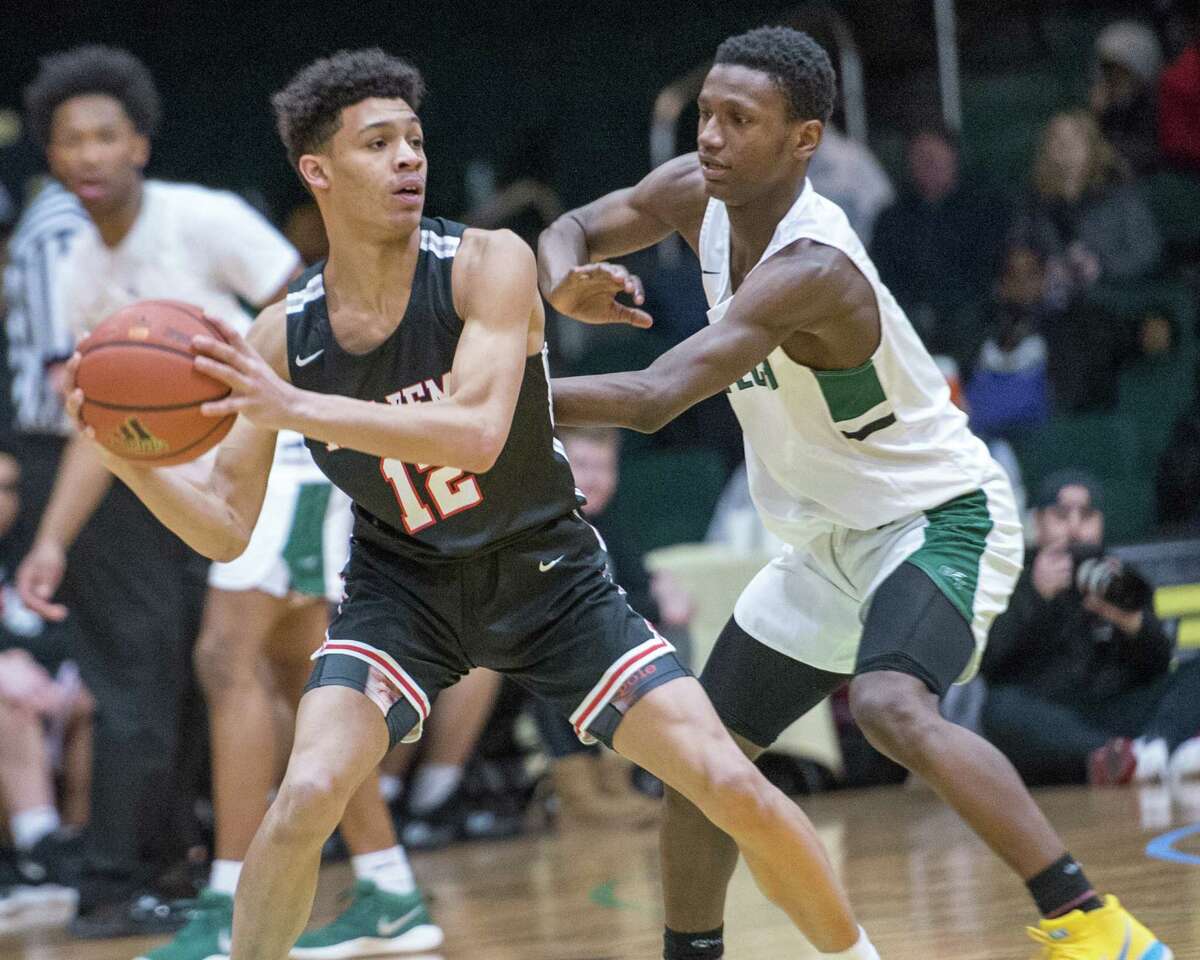 Albany Academy sophomore Marcus Jackson, left, goes against Green Tech junior Mazziah Thorpe during the Slam North South Classic at Washington Avenue Armory on Saturday, Jan. 19, 2019. (Jim Franco / Special to the Times Union)