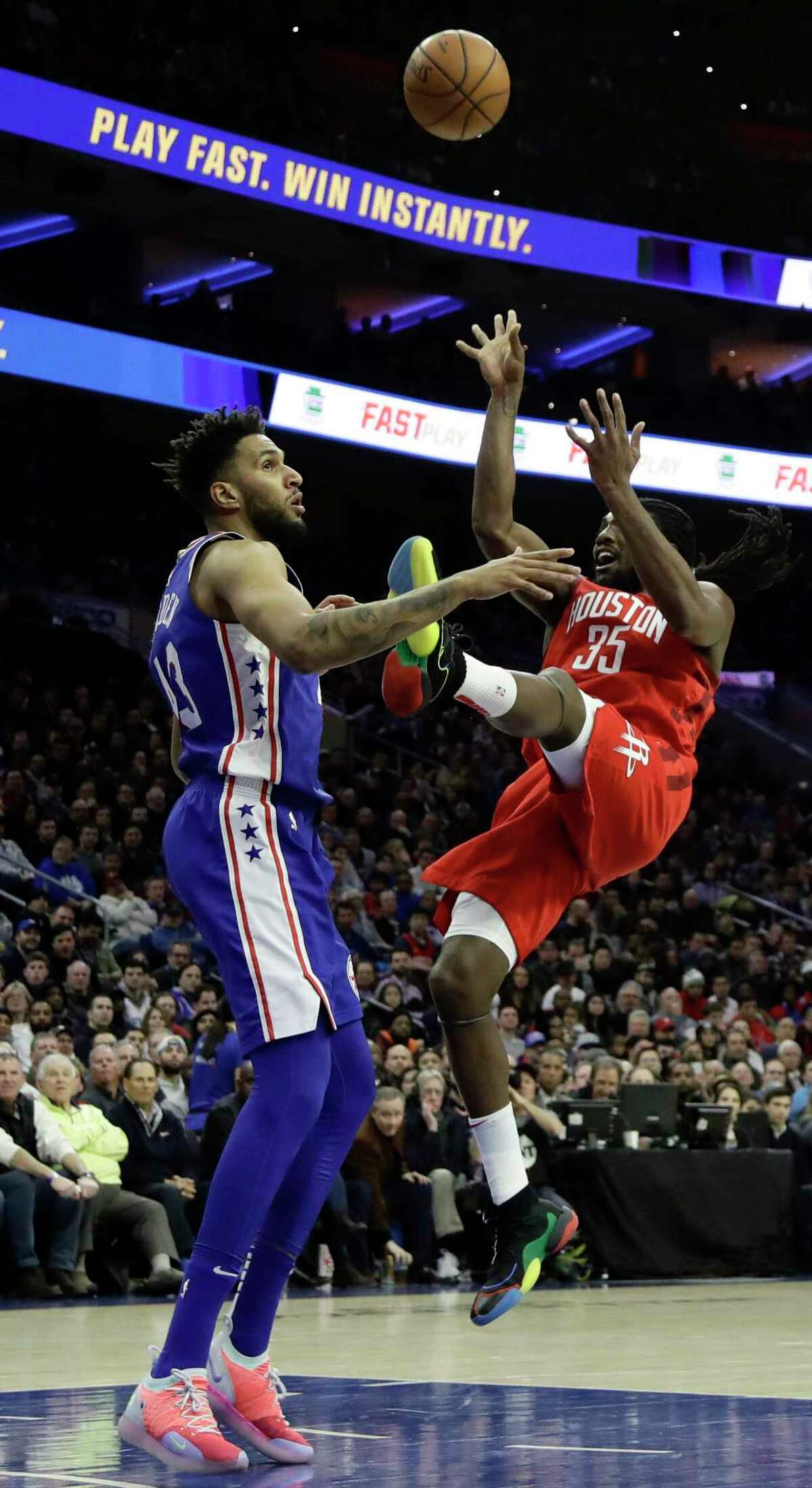 Houston Rockets' Kenneth Faried, right, goes up for a shot against Philadelphia 76ers' Jonah Bolden during the first half of an NBA basketball game, Monday, Jan. 21, 2019, in Philadelphia. (AP Photo/Matt Slocum)