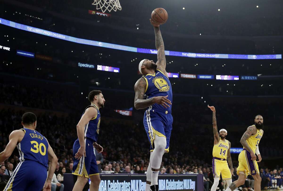 Golden State Warriors' DeMarcus Cousins (0) grabs a rebound against the Los Angeles Lakers during the first half of an NBA basketball game, Monday, Jan. 21, 2019, in Los Angeles. (AP Photo/Marcio Jose Sanchez)