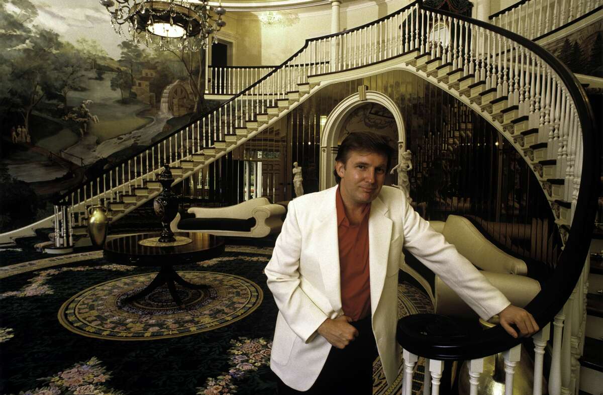 Donald Trump, real estate mogul, entrepreneur, and billionare poses in the foyer of his home in August 1987 in Greenwich, Connecticut.