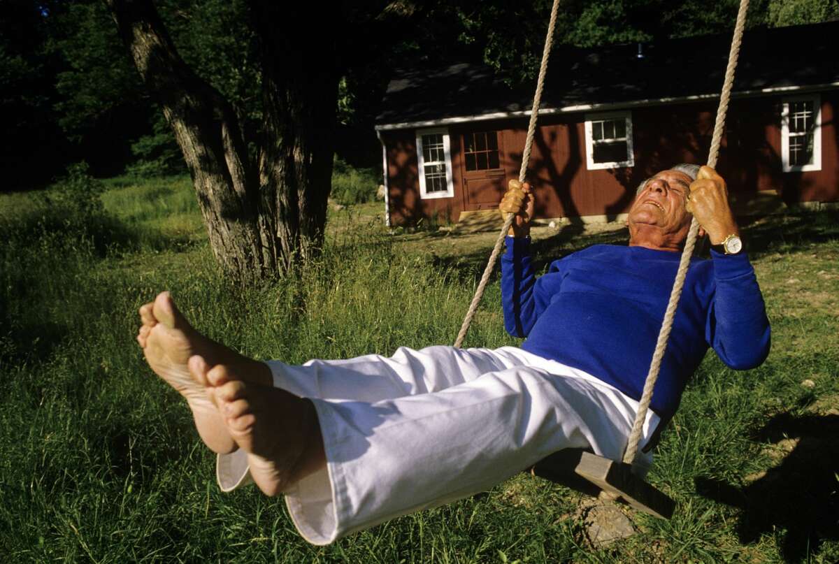 Composer Leonard Bernstein swings on 1986 outside of his Fairfield, Connecticut home. Bernstein's most recognizable affiliation was as the longtime music director of the New York Philharmonic Orchestra. In addition, Bernstein was noted for writing the music for the highly acclaimed musical, West Side Story.