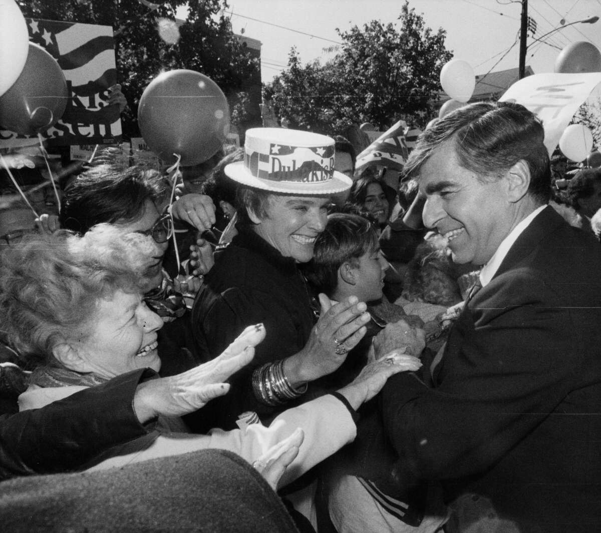 Presidential candidate and Governor Michael Dukakis shakes hands with the crowd after delivering a campaign speech in New Haven, CT., on Oct. 20, 1988.