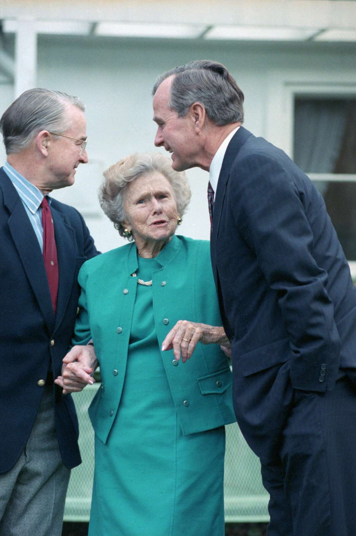 President Bush gets the once over from his mother Dorothy during his visit to her home.