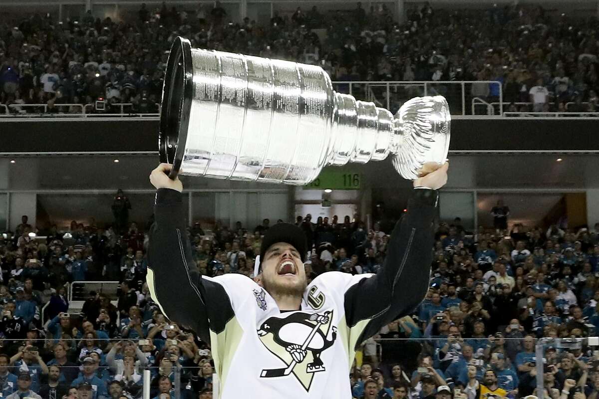 SAN JOSE, CA - JUNE 12: Sidney Crosby #87 of the Pittsburgh Penguins celebrates with the Stanley Cup after their 3-1 victory to win the Stanley Cup against the San Jose Sharks in Game Six of the 2016 NHL Stanley Cup Final at SAP Center on June 12, 2016 in San Jose, California. (Photo by Bruce Bennett/Getty Images)