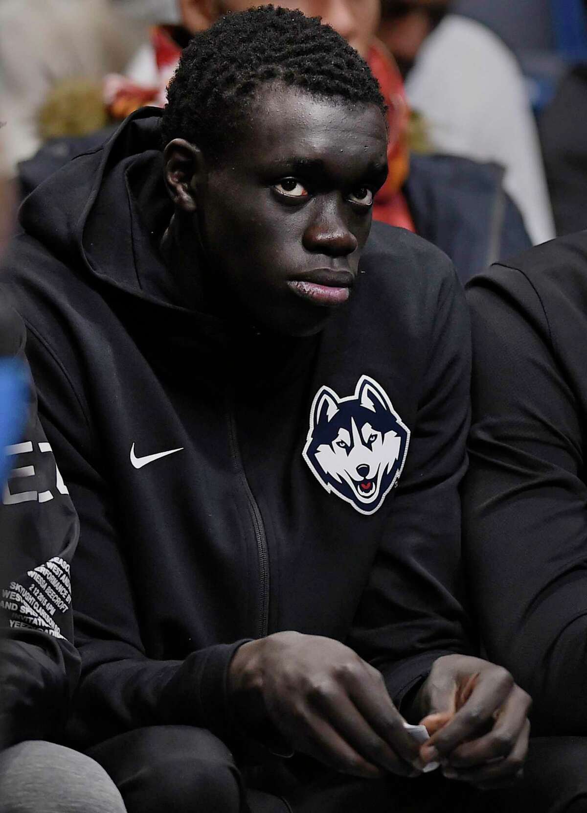 Akok Akok is here, but only as a spectator for UConn men