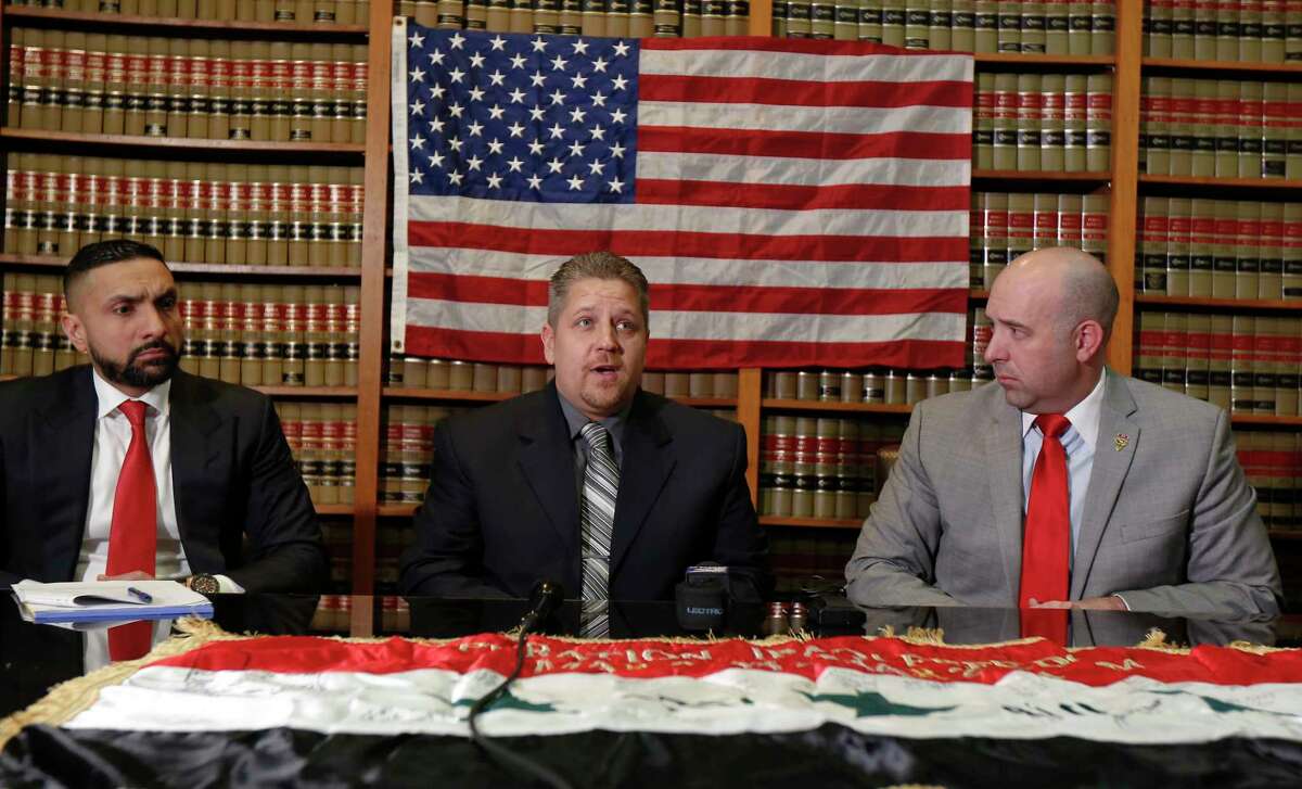 Houston attorneys Mo Aziz (left) and Andrew Cobos (right) represent Sergeant Scott D. Rowe (center), a United States Army veteran, in a lawsuit against 3M Company Tuesday, Jan. 22, 2019, in Houston. The lawsuit focuses on 3M Company, manufacturer of the dual-ended Combat Arms™ earplugs issued to veterans who served in the U.S. military between 2002 and 2013. The lawsuit alleges that 3M Company designed and manufactured the earplugs in a defective manner and failed to warn users of these defects or to provide proper instructions for their use, which has resulted in hearing loss, tinnitus (ringing or buzzing in the ears), and loss of balance in those who used 3M’s dual-ended Combat Arms™ earplugs during their military service.