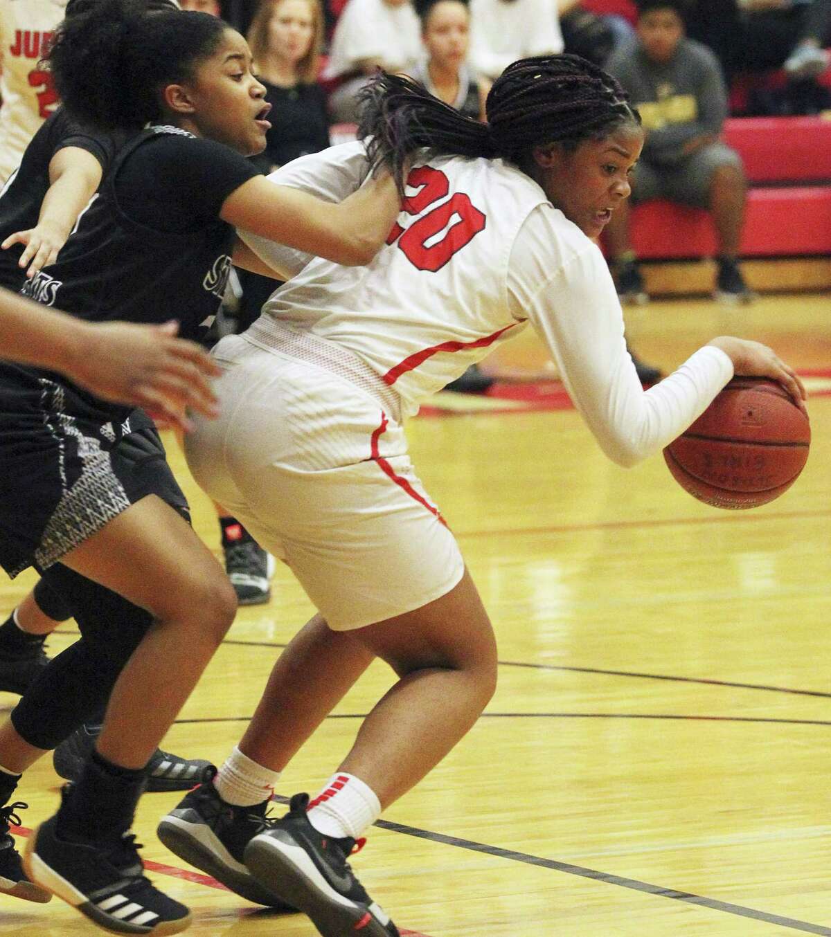 The Rocket's Kierra Sanderlin pivots at the top of the key on Bria McClure as Judson hosts Steele in girls basketball at Judson High School gym on January 22, 2019.