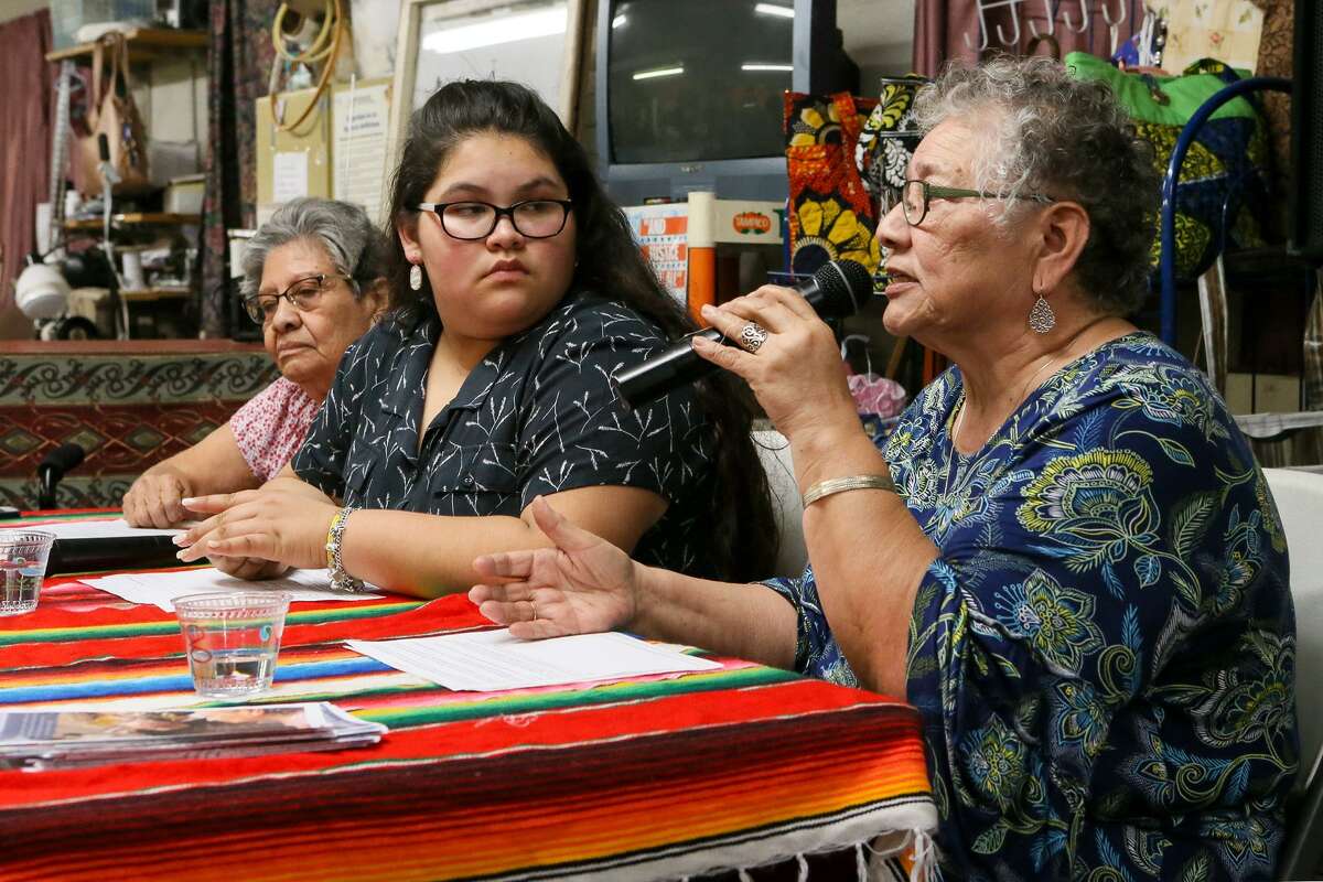 Petra Mata (from right) speaks from the head table along with Olivia Quintero, 14, and Viola Casares at the Fuerza Unida headquarters on New Laredo Highway on Tuesday, Jan. 22. Mata and Quintero are co-founders and co-directors of Fuerza Unida, an organization headed by South Side women, celebrating its 29th year of fighting for environmental, economic and social justice. Quintero is a participant in the organization’s youth program.