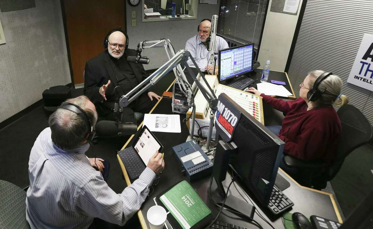 Minister Dr. David Capes, clockwise from bottom left, Father Mario Arroyo and Rabbi Stuart Federow, tape "A Show of Faith", with producer Sharon Trimbly on Sunday, Dec. 23, 2018 in Houston. The show covers religion and news of the day.