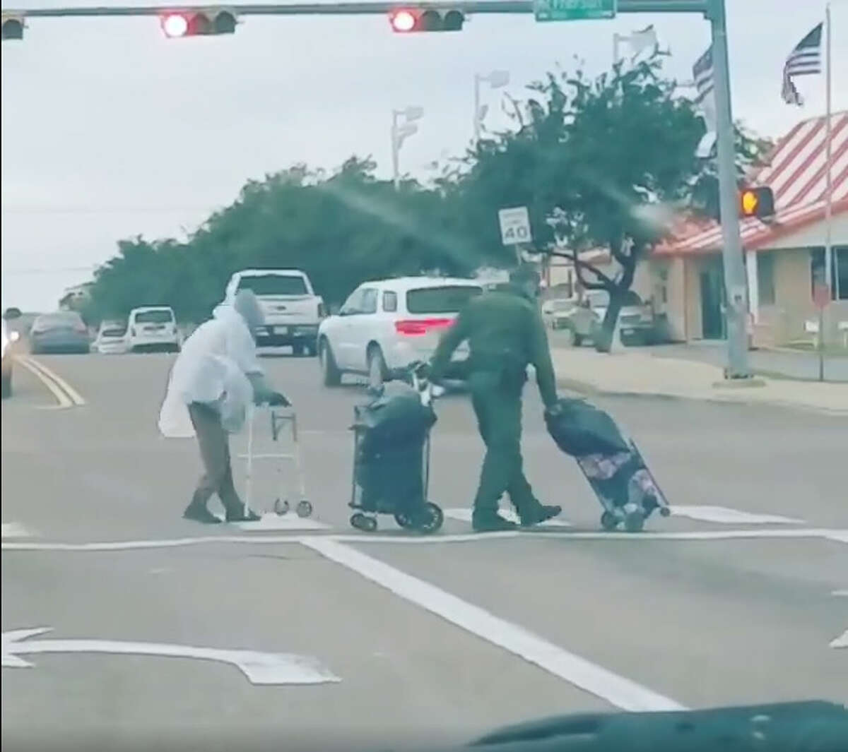In a video posted on Facebook Wednesday, a Laredo Border Patrol agent is seen helping an elderly individual through a busy intersection.