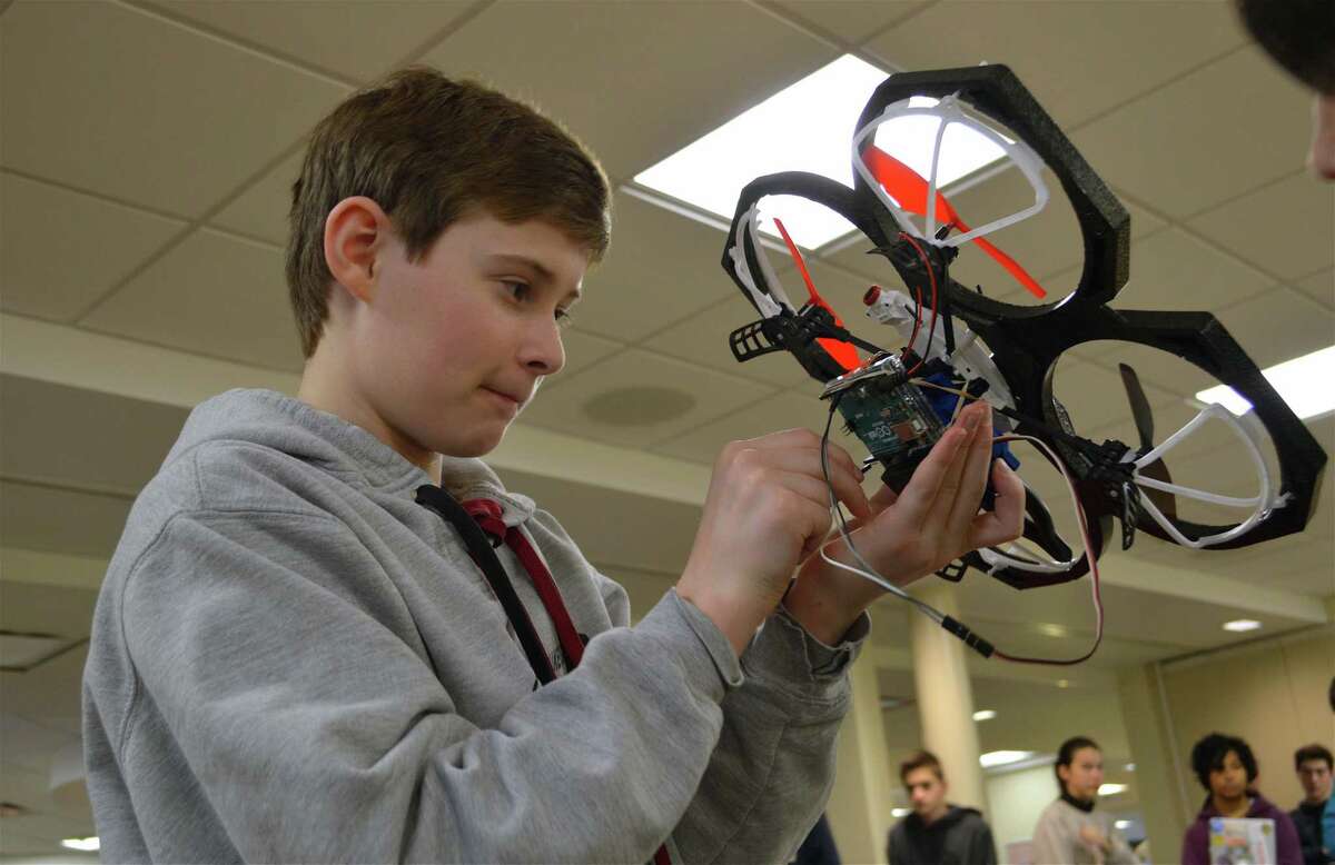 William Warren, 13, of Pound Ridge, N.Y., works on his drone at the 5th annual Hack-a-Thon at St. Luke’s School.
